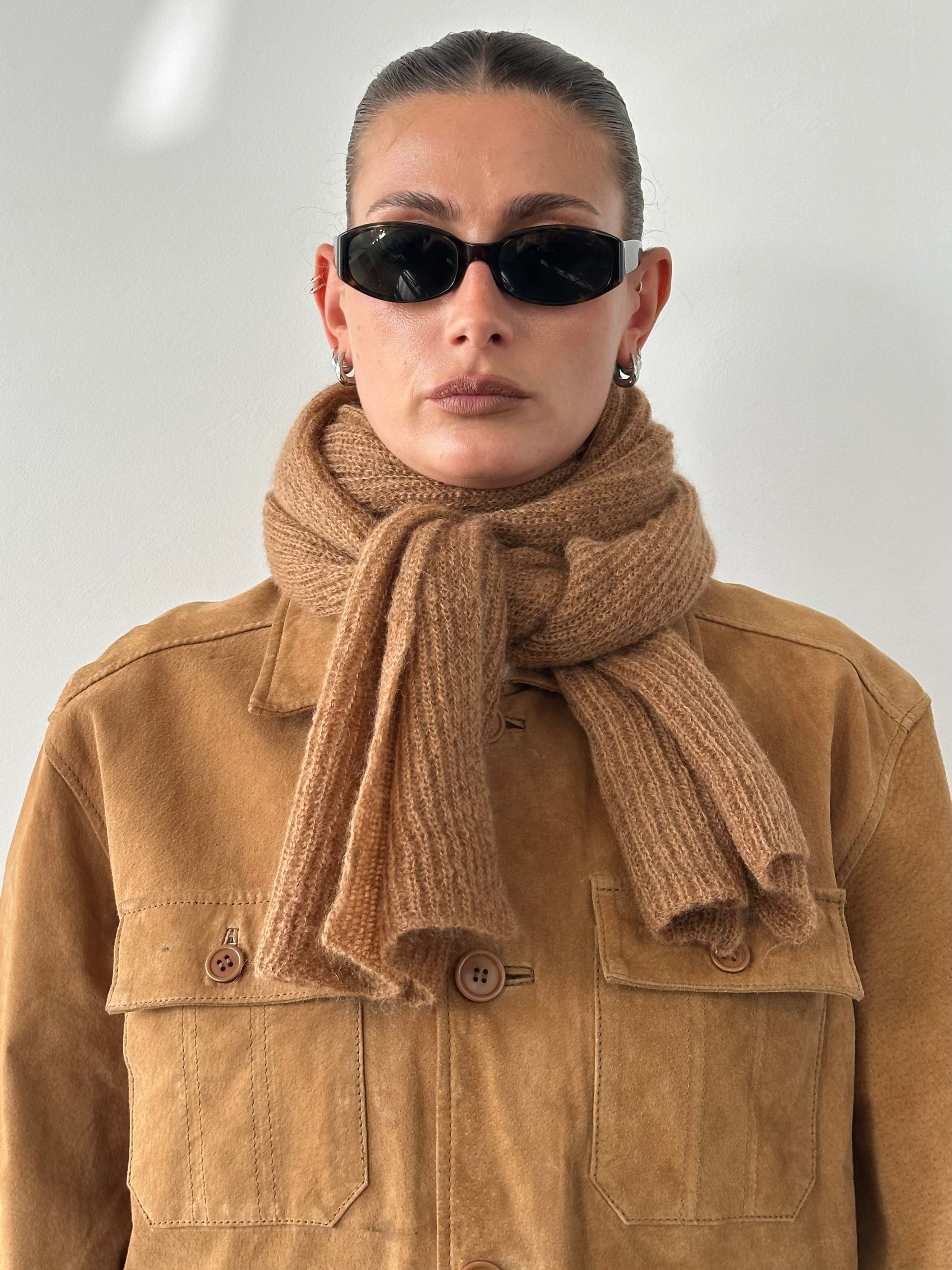Vintage wool mohair long scarf with a soft, textured fabric in neutral tones, perfect for stylish winter wear.