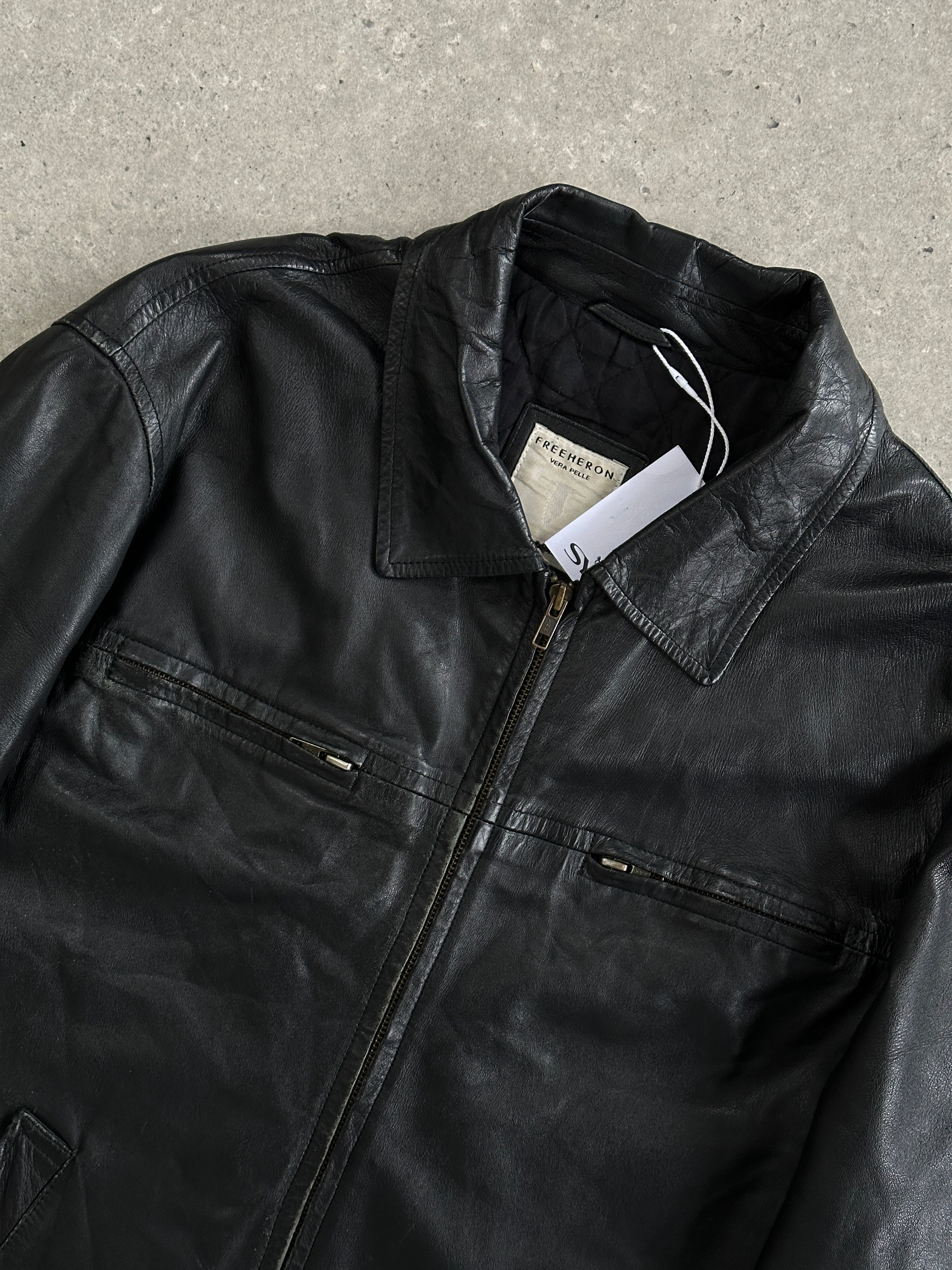 Conbipel zip-up leather jacket in size L, showcasing sleek black leather with silver zipper details and stylish collar.