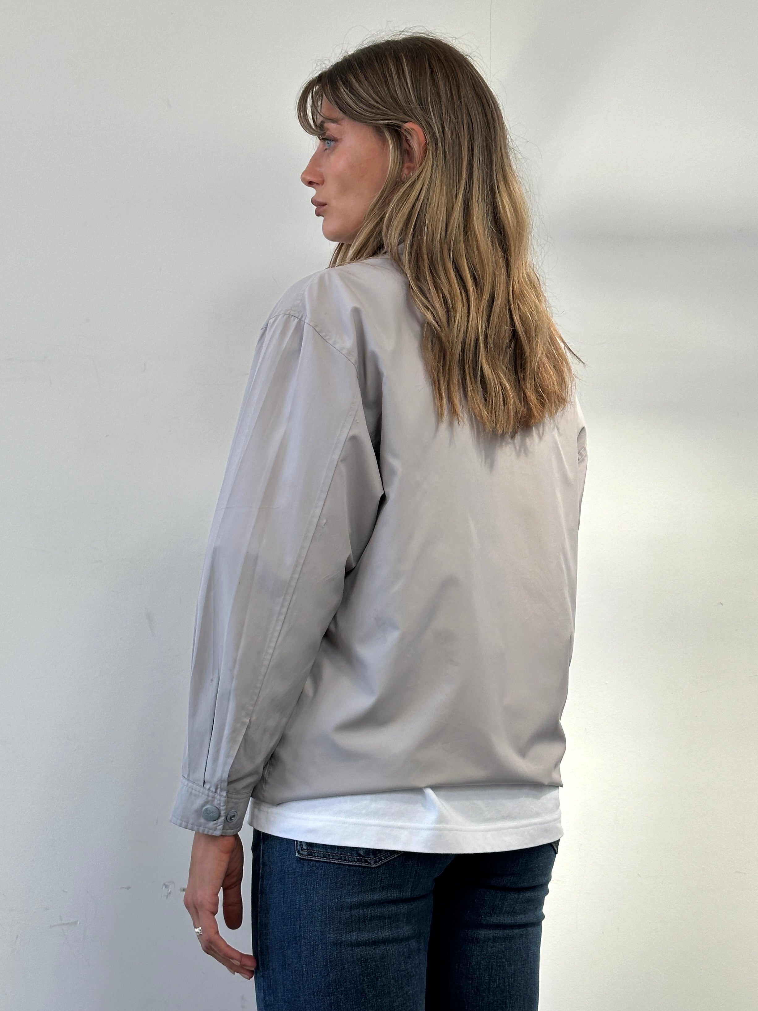 Yves Saint Laurent logo bomber jacket in size M, black with signature YSL branding on the front and ribbed cuffs.