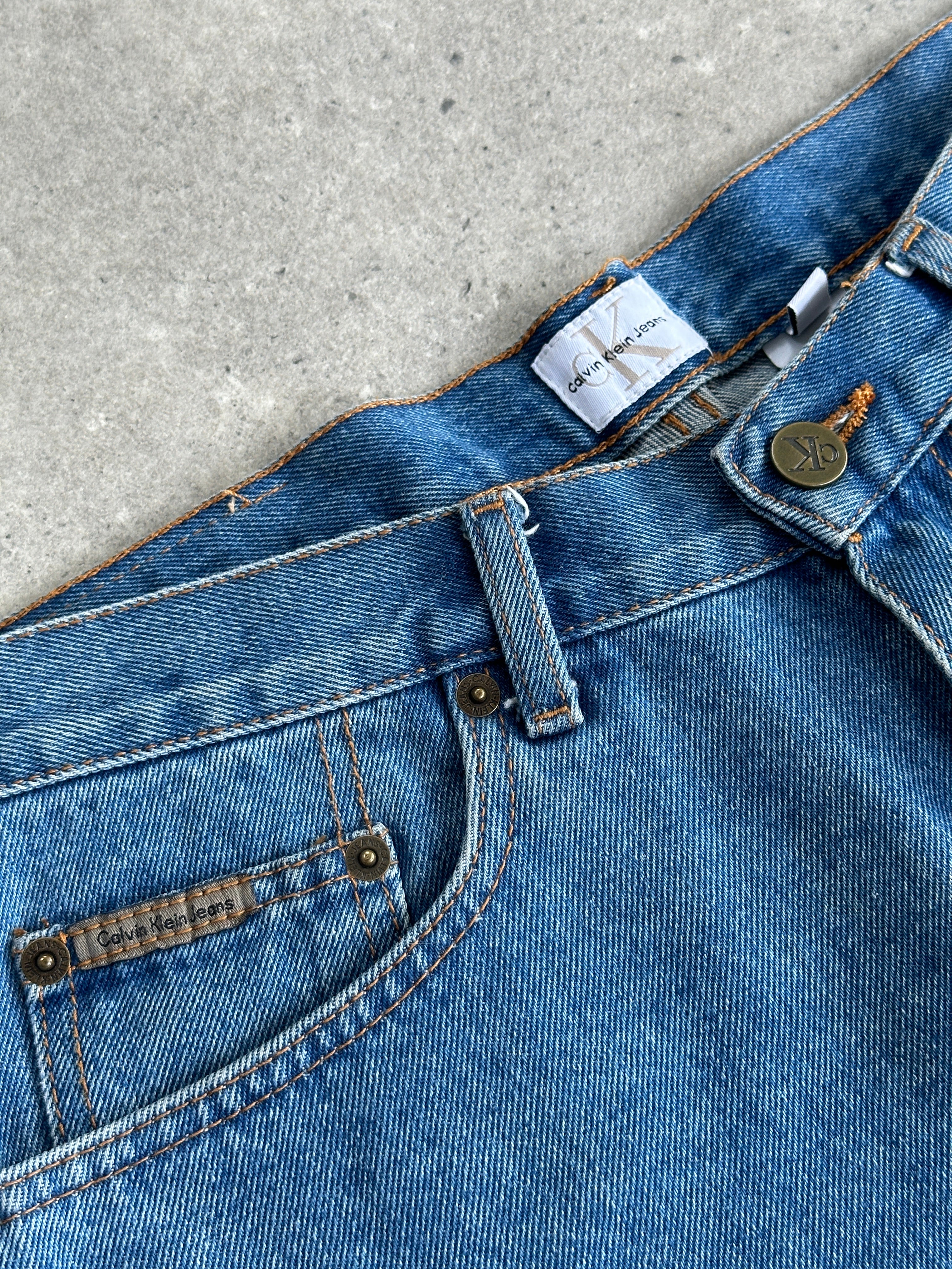 Calvin Klein CK loose leg denim shorts in W32, featuring a relaxed fit and classic blue denim fabric.