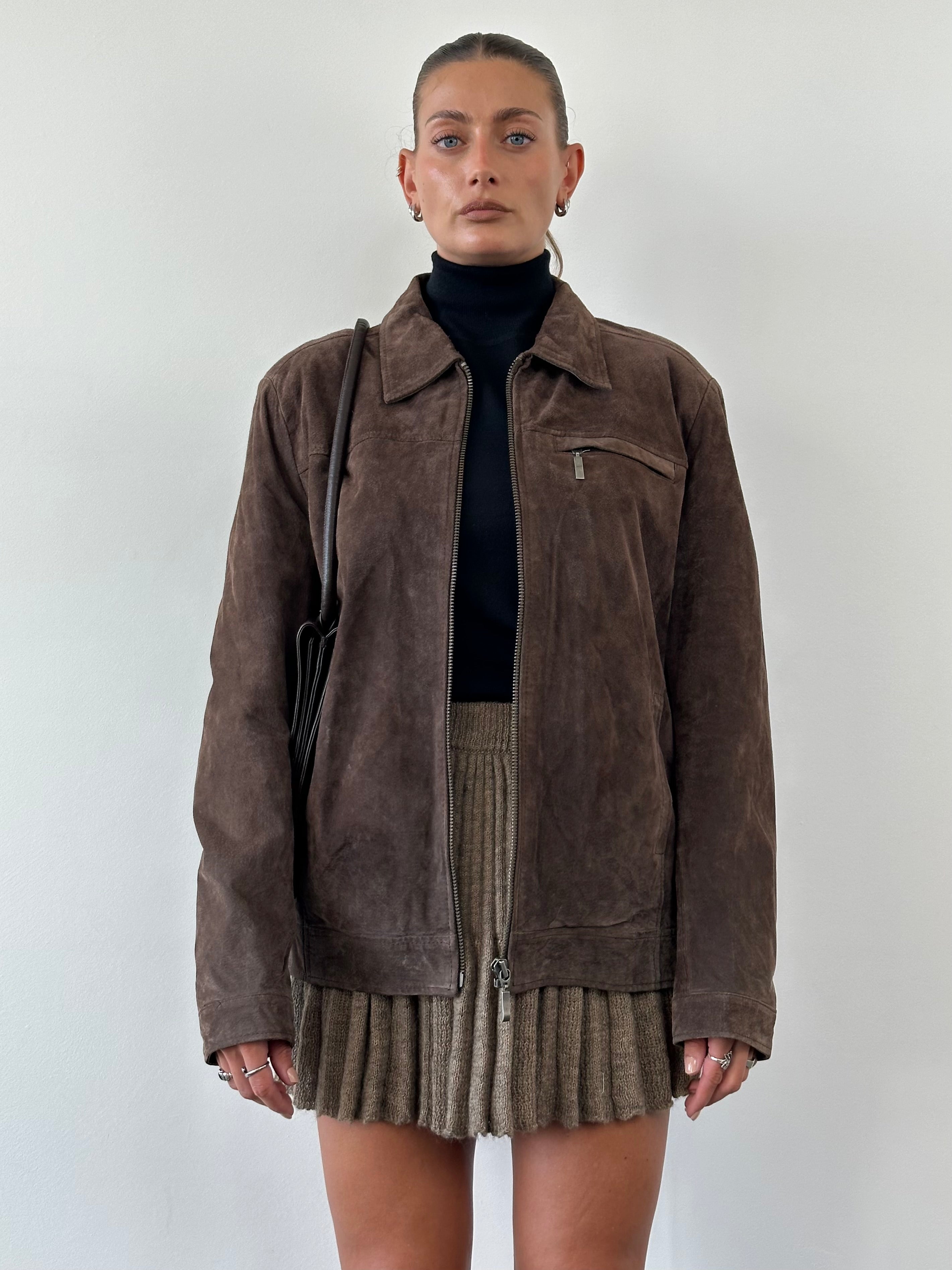 Vintage suede zip-up jacket in size large, featuring a classic design with a front zipper and soft suede material.