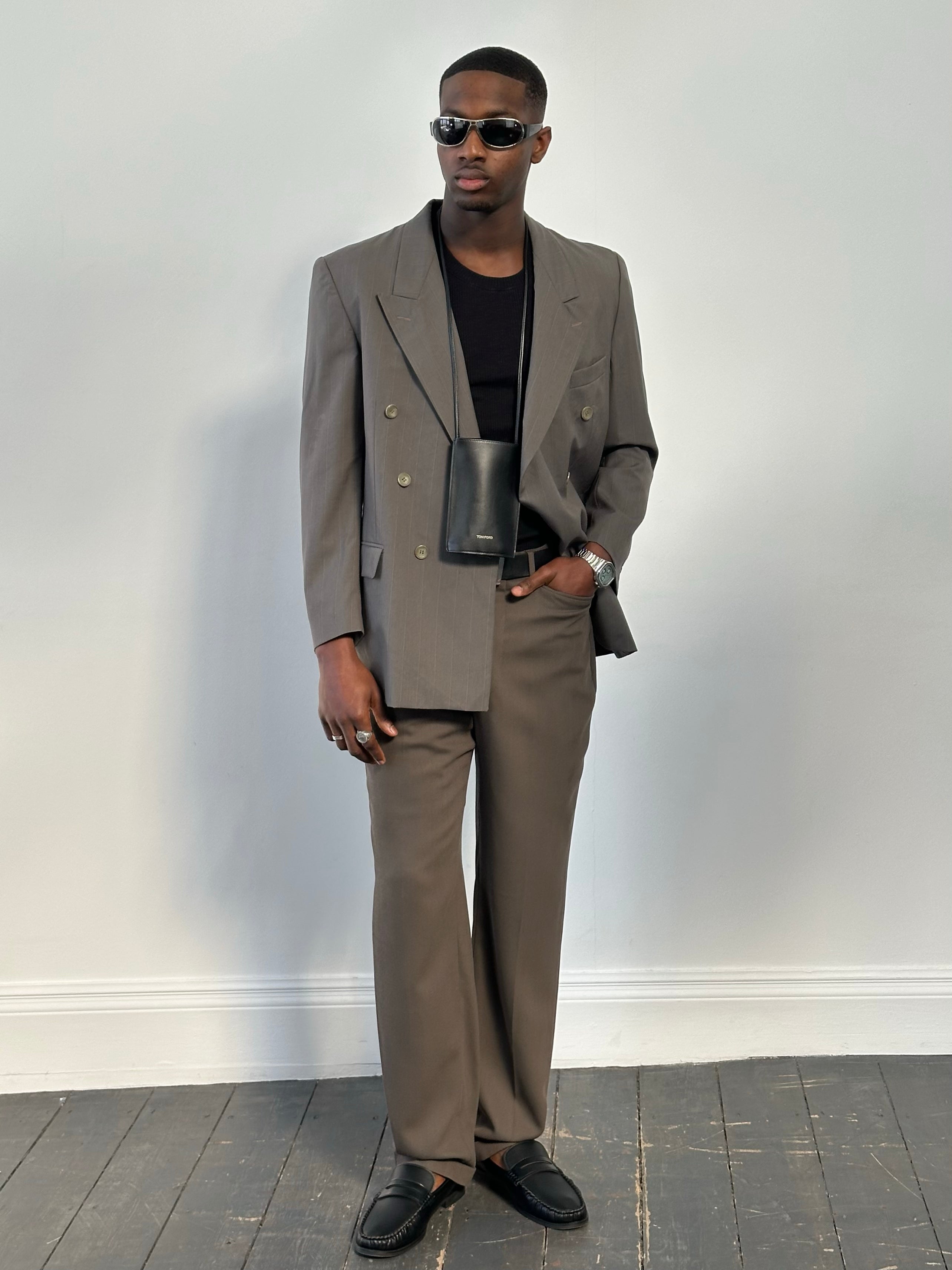 Yves Saint Laurent 1990s pure wool double-breasted blazer in classic style, featuring a tailored fit and button details.