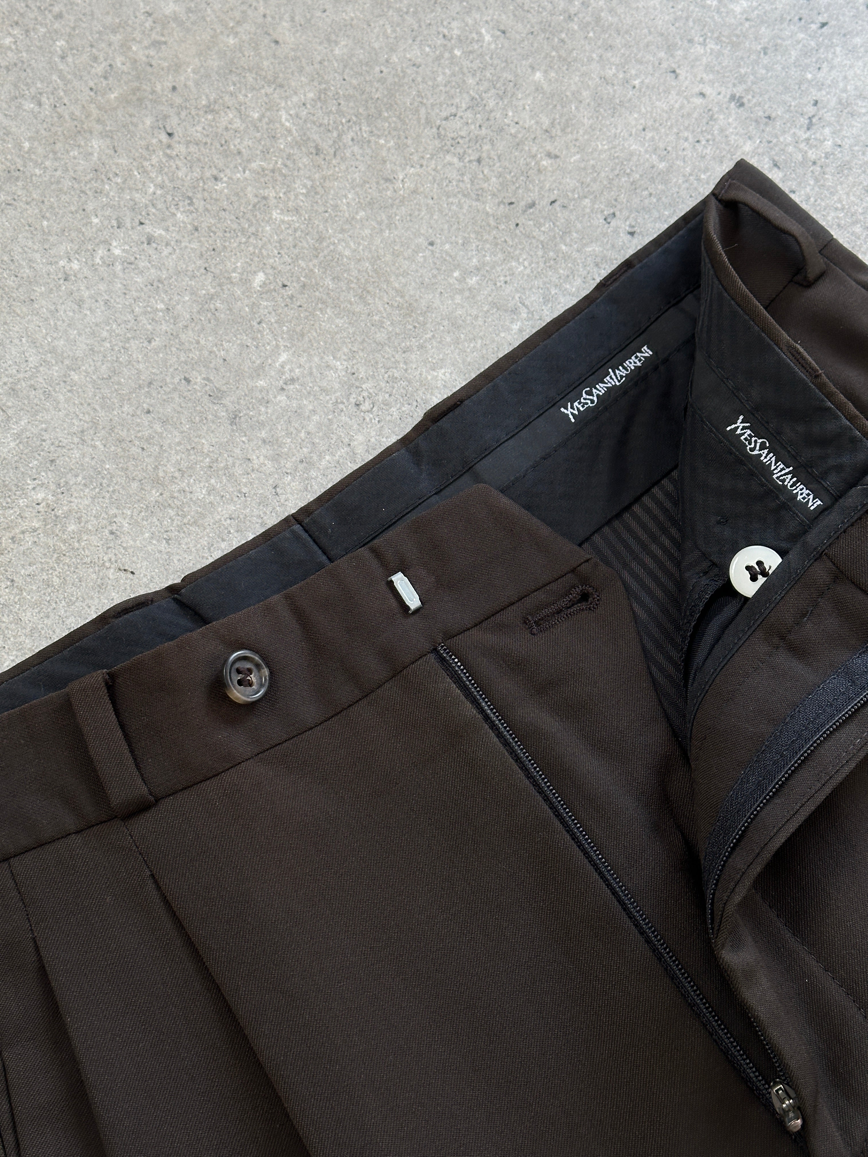 Yves Saint Laurent Pour Homme 1990s pure wool tailored trousers in size W28, showcasing classic fit and refined craftsmanship.