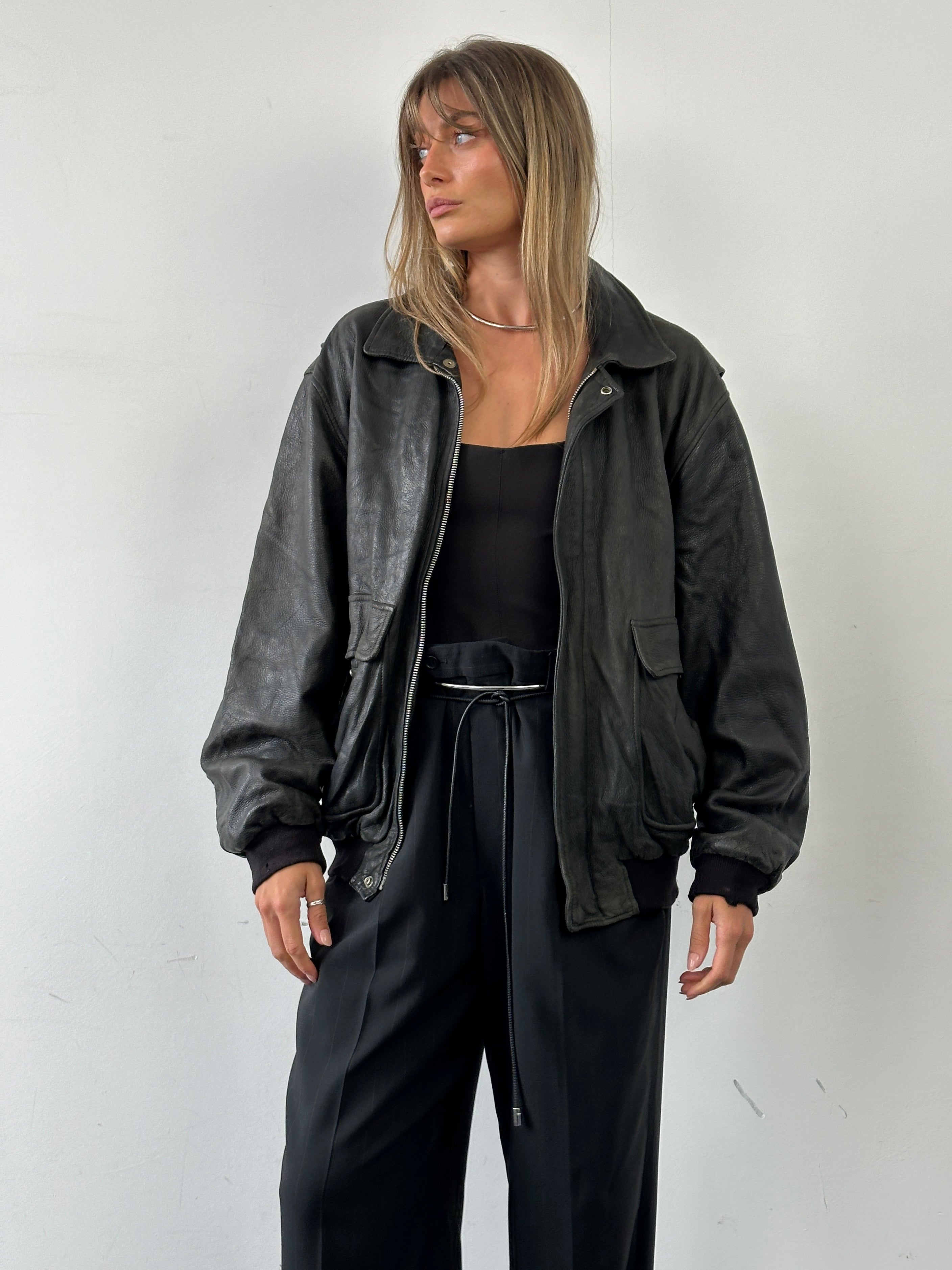 Italian vintage aged leather bomber jacket in XL size, featuring classic design and distressed leather details.
