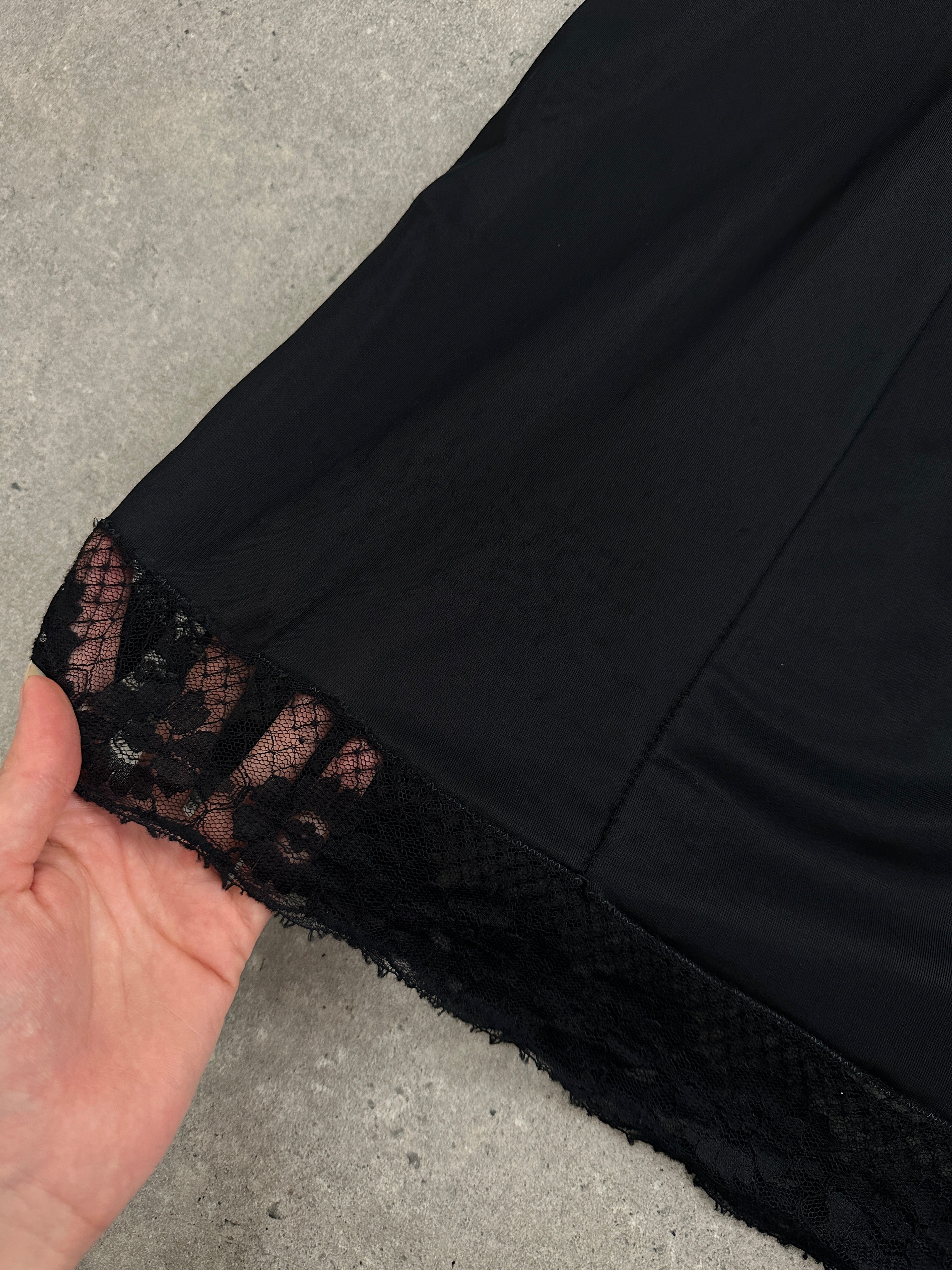 Vintage 1980s lace semi-sheer slip dress in size M, featuring delicate floral lace and a classic vintage style.