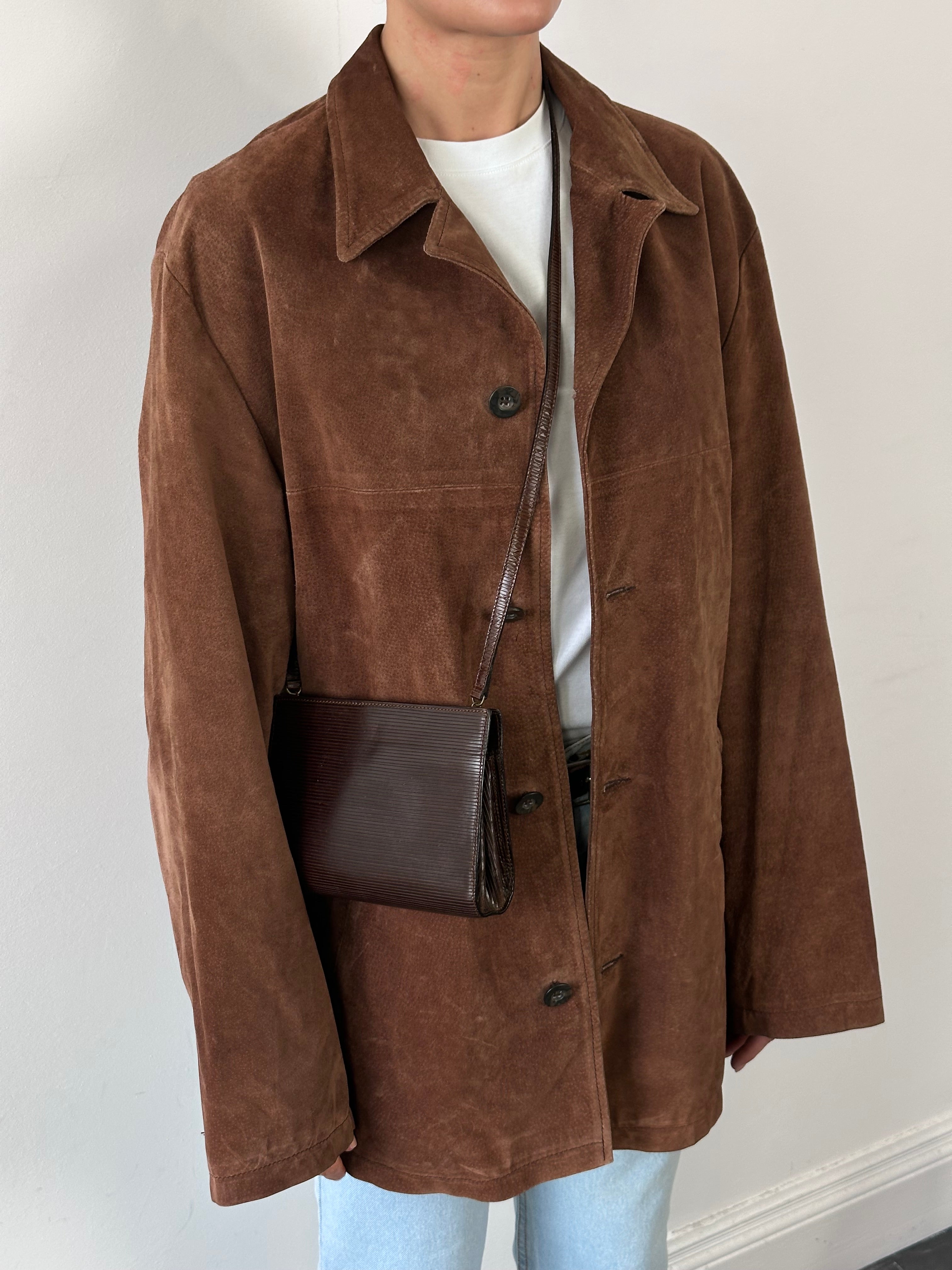 Vintage brand vintage suede leather jacket in size XL, featuring a classic design and soft textured material.