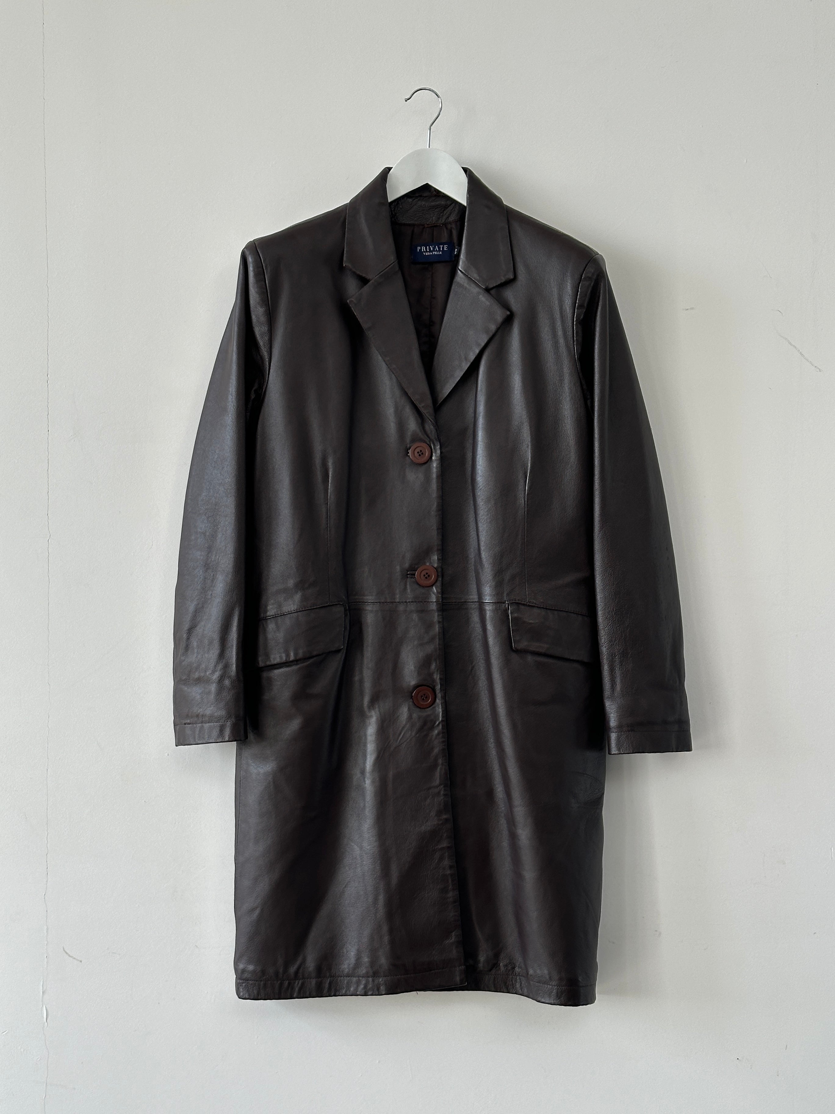 Vintage minimal leather trench coat jacket in size large, featuring classic design and smooth leather finish.