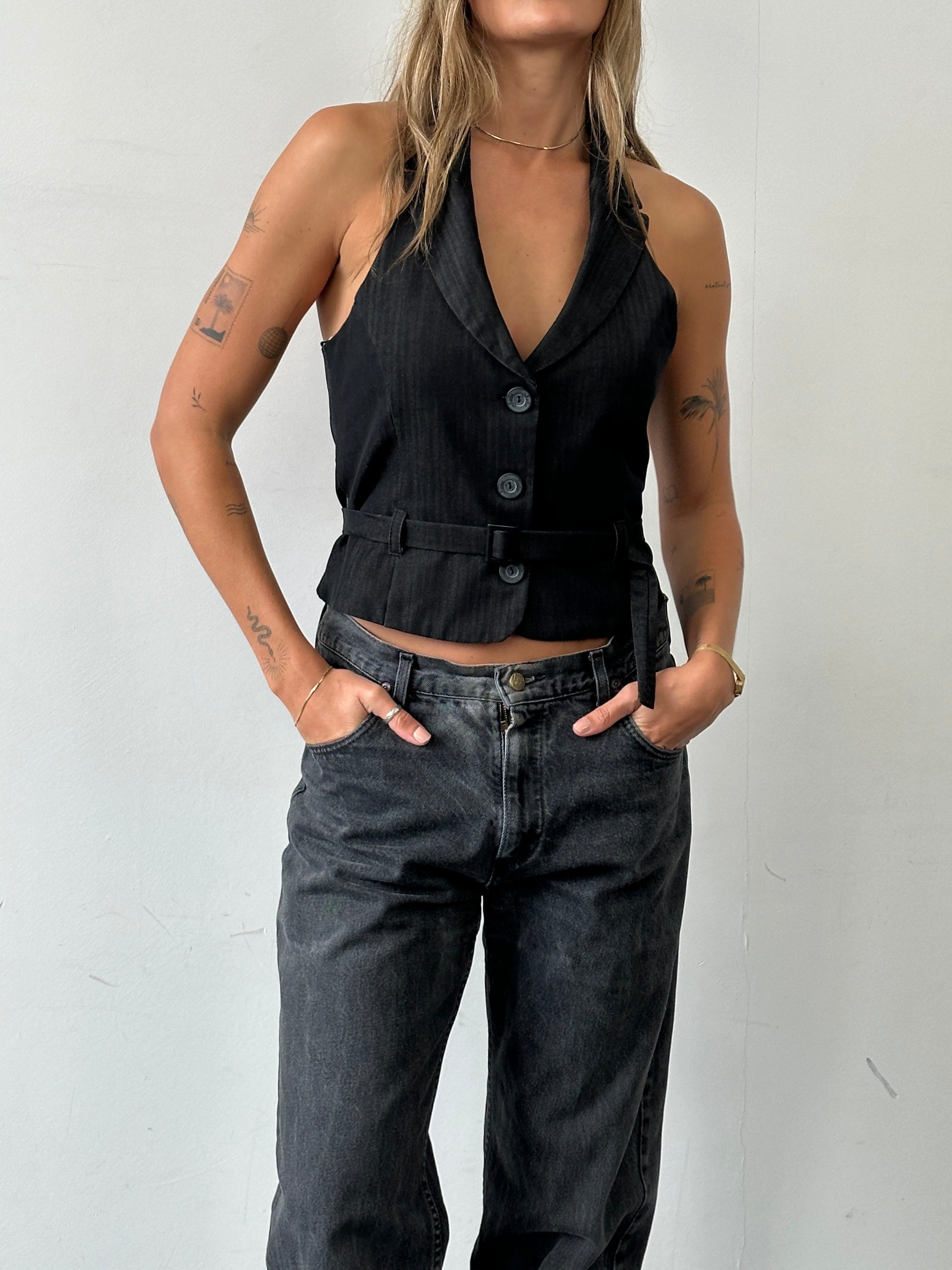 Vintage women's halterneck belted waistcoat, size M, featuring a classic design and tailored fit.