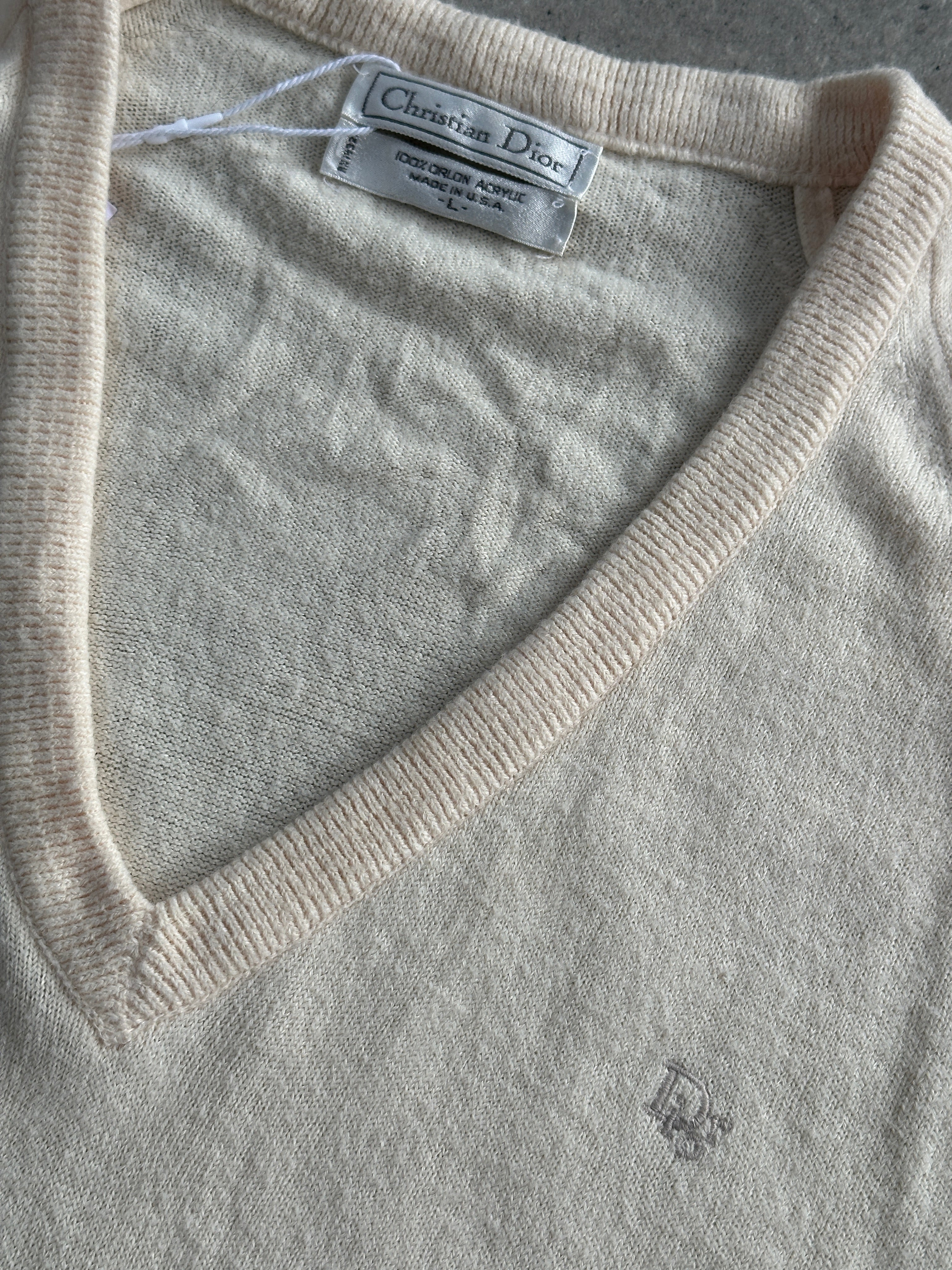 Christian Dior 1980s V-neck logo knitted jumper in size L/XL, featuring a classic design and Dior branding on the front.