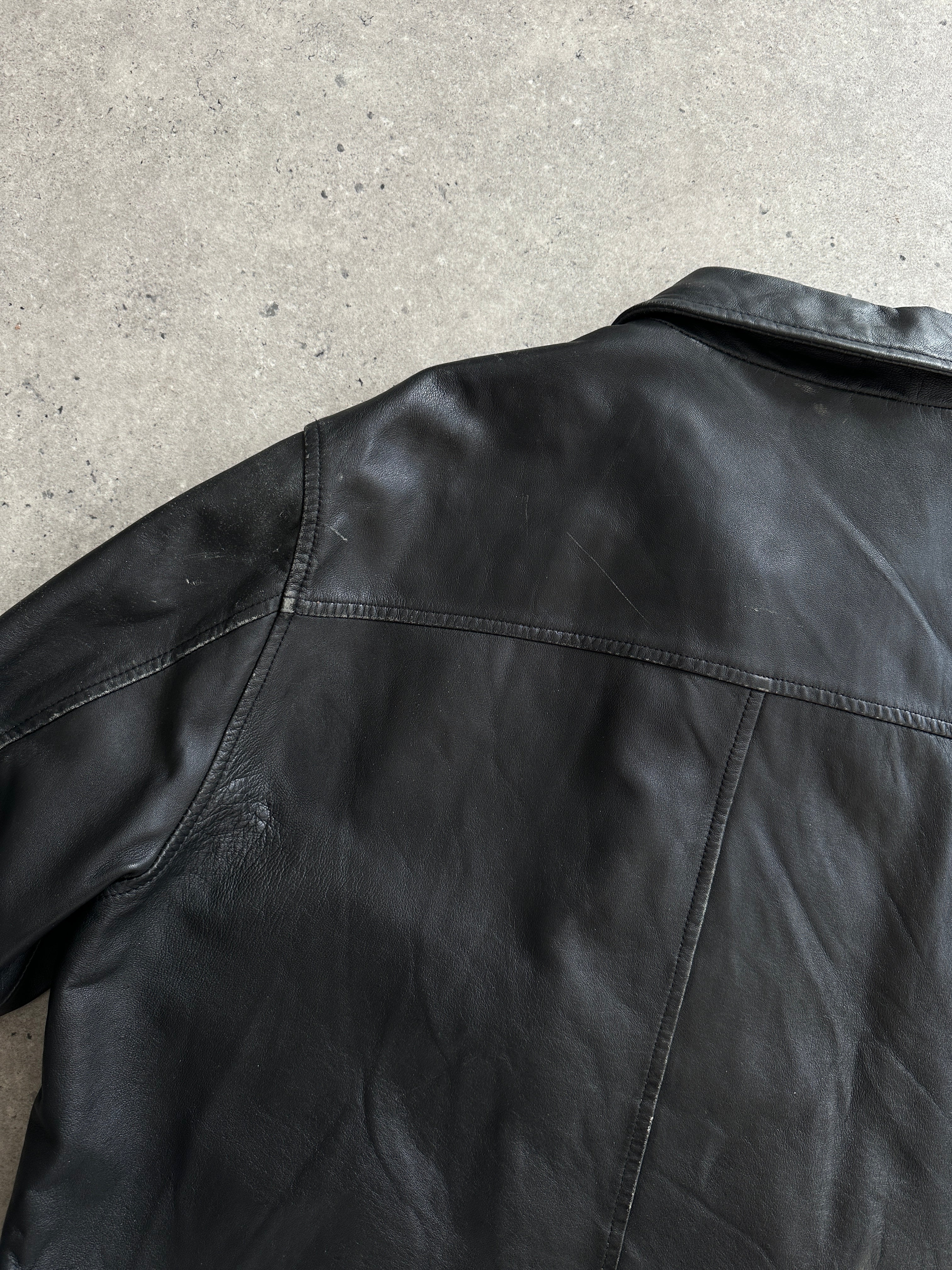 Conbipel minimal leather jacket in size L, featuring sleek design and high-quality leather, stylish outerwear for men.
