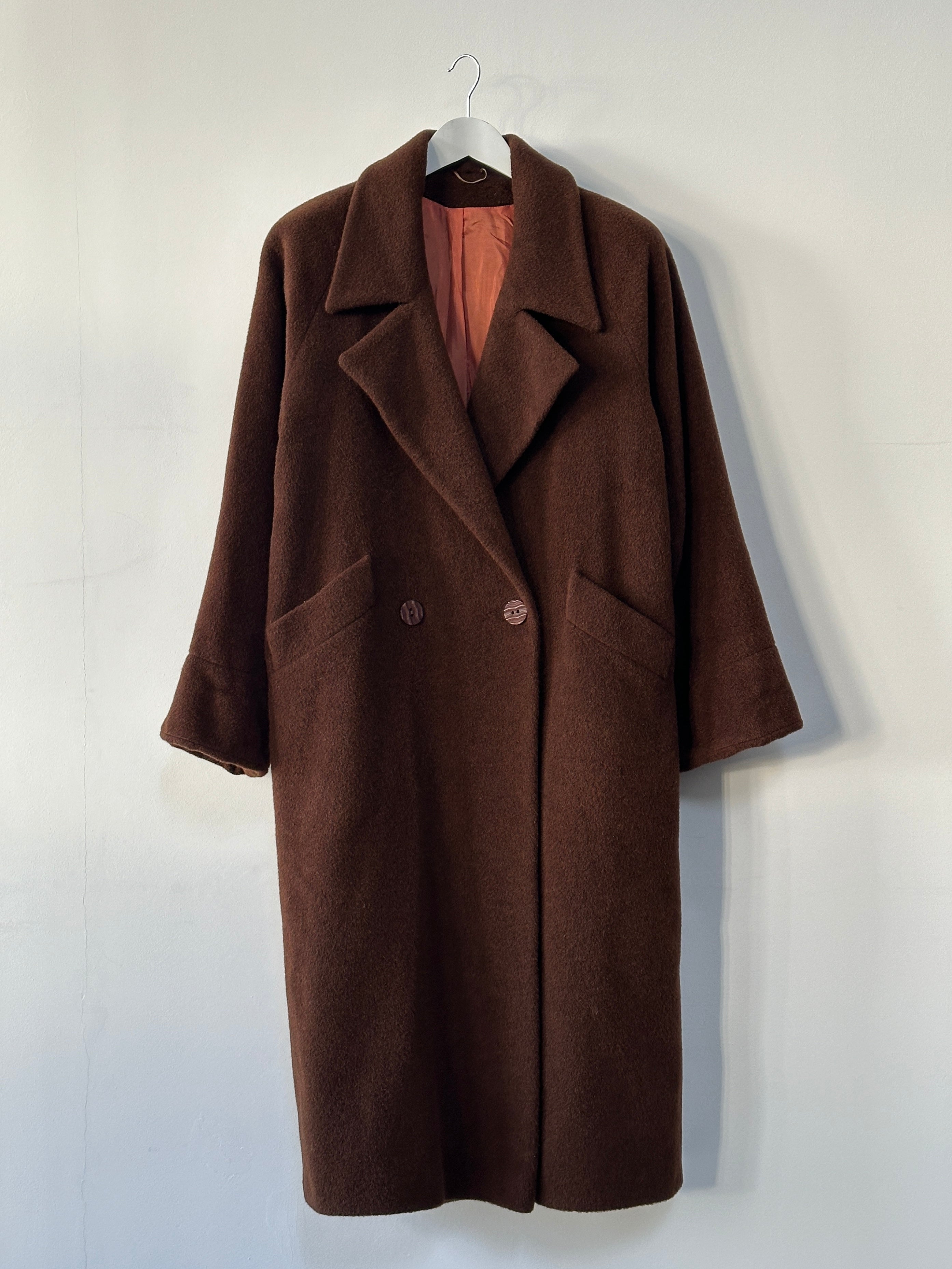Vintage XL alpaca wool fuzzy coat with relaxed fit, showcasing soft, textured fabric and cozy style.
