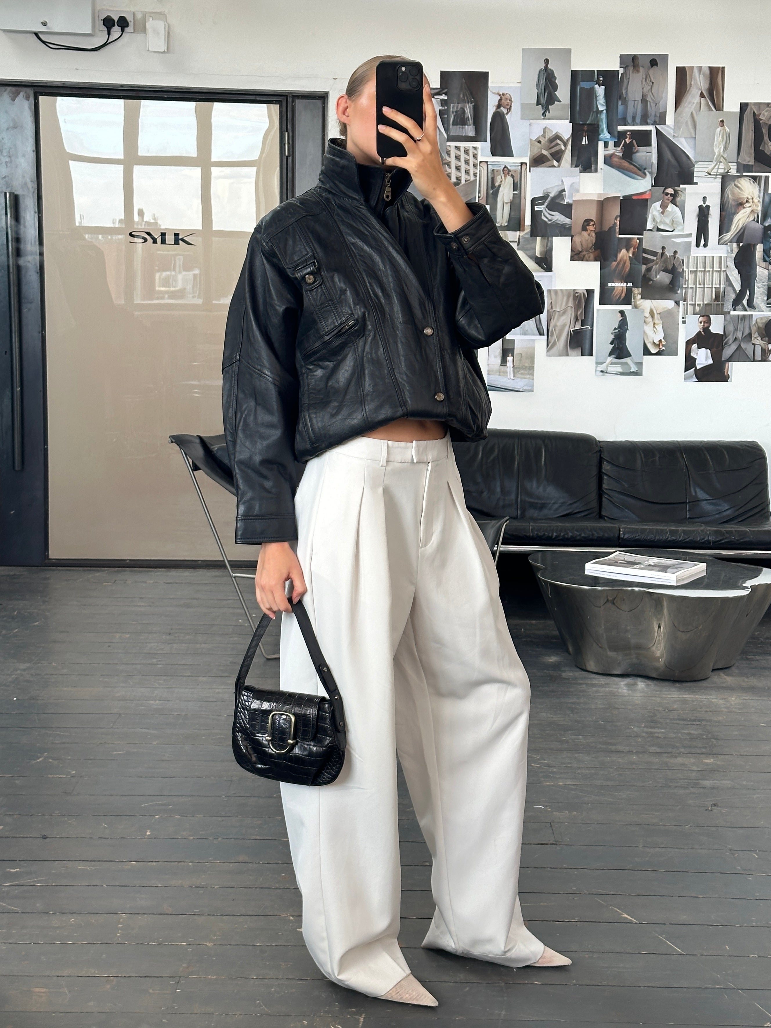 Vintage 1990s high neck leather bomber jacket, size medium, with classic design and durable leather material.