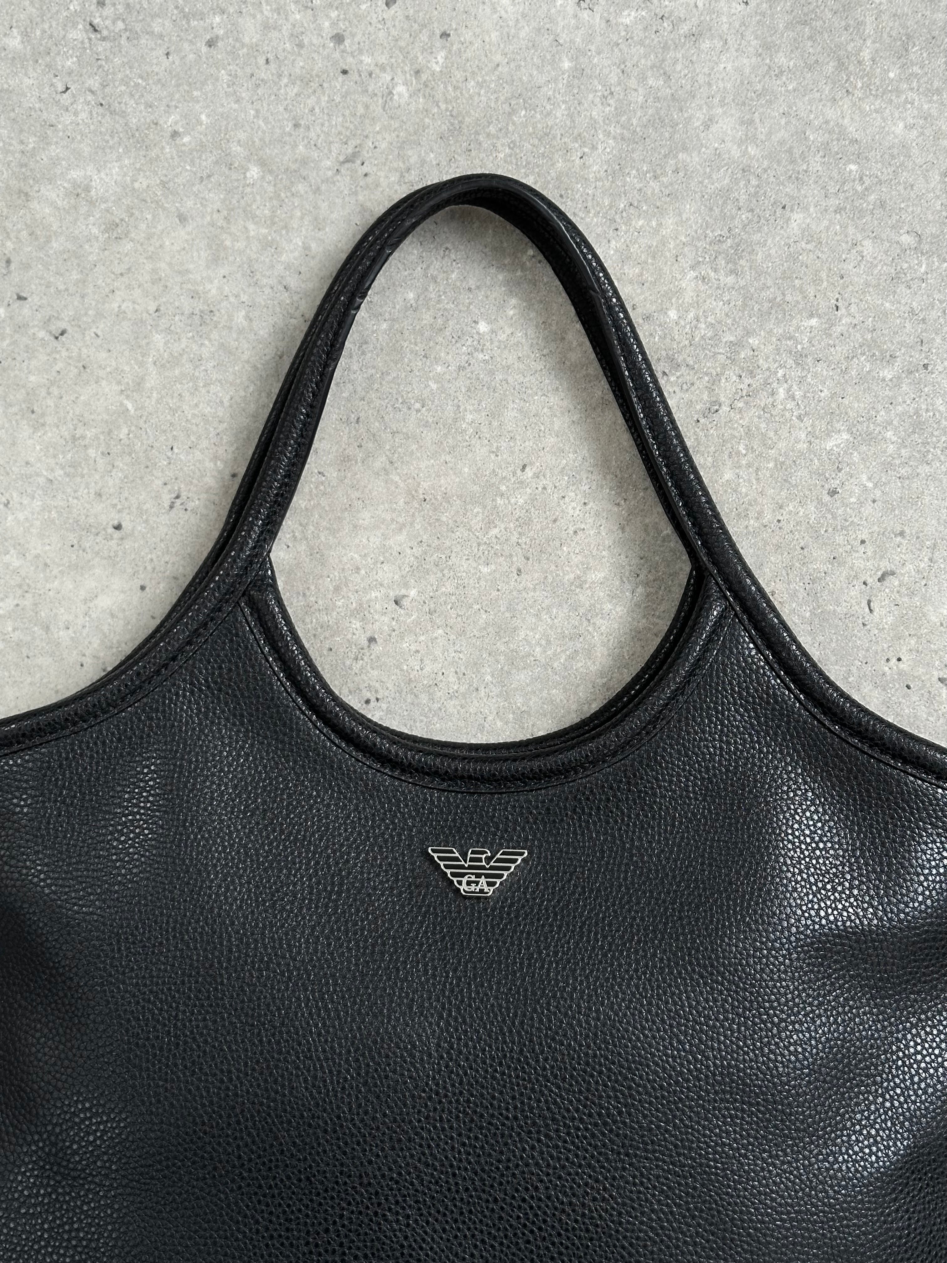 Emporio Armani 1990s leather shoulder bag with sleek design and silver hardware, featuring a spacious interior and adjustable strap.