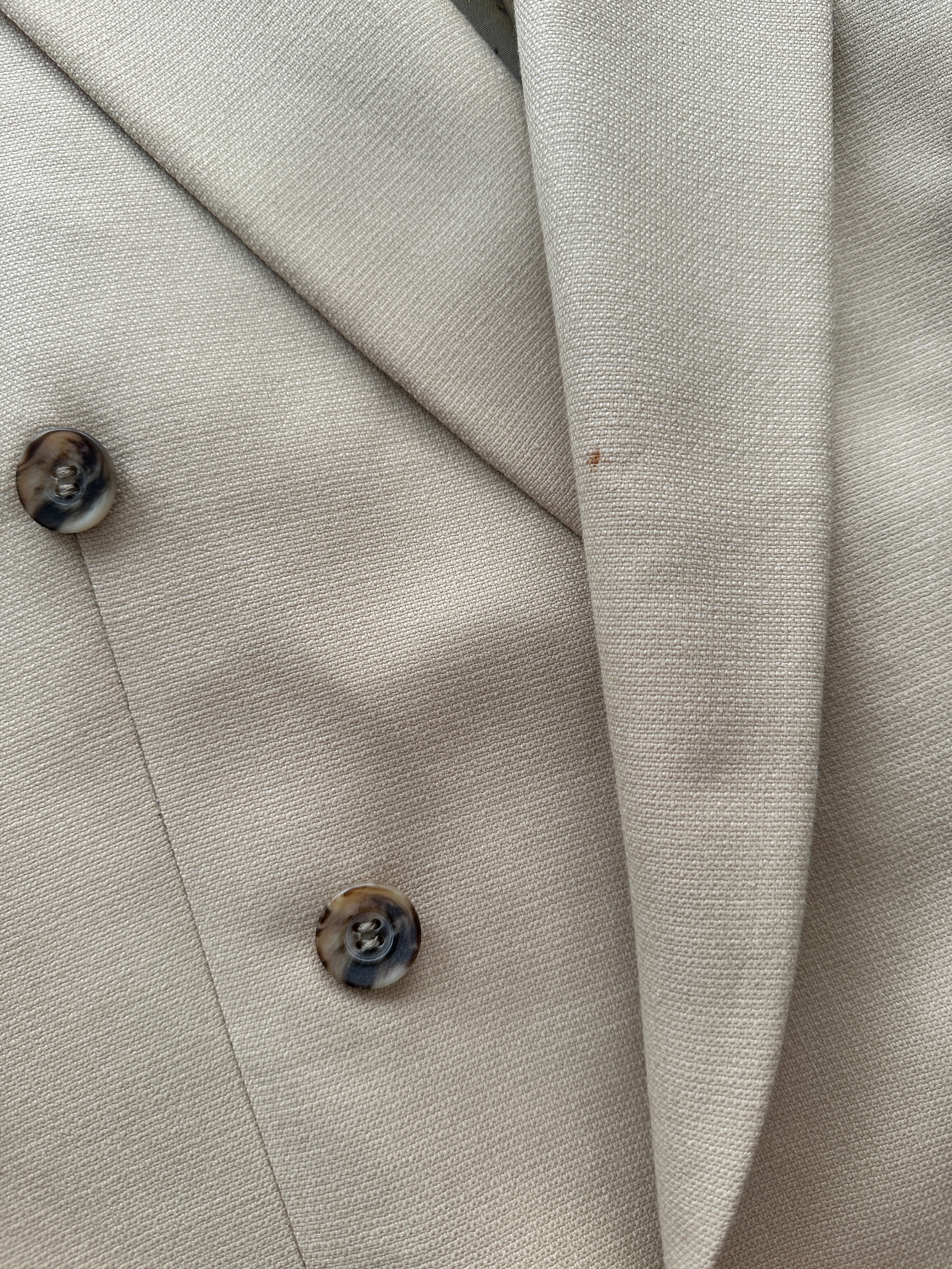 Vintage wool double-breasted blazer in size 40R/L, tailored fit with classic lapels and button details, shown on a hanger.