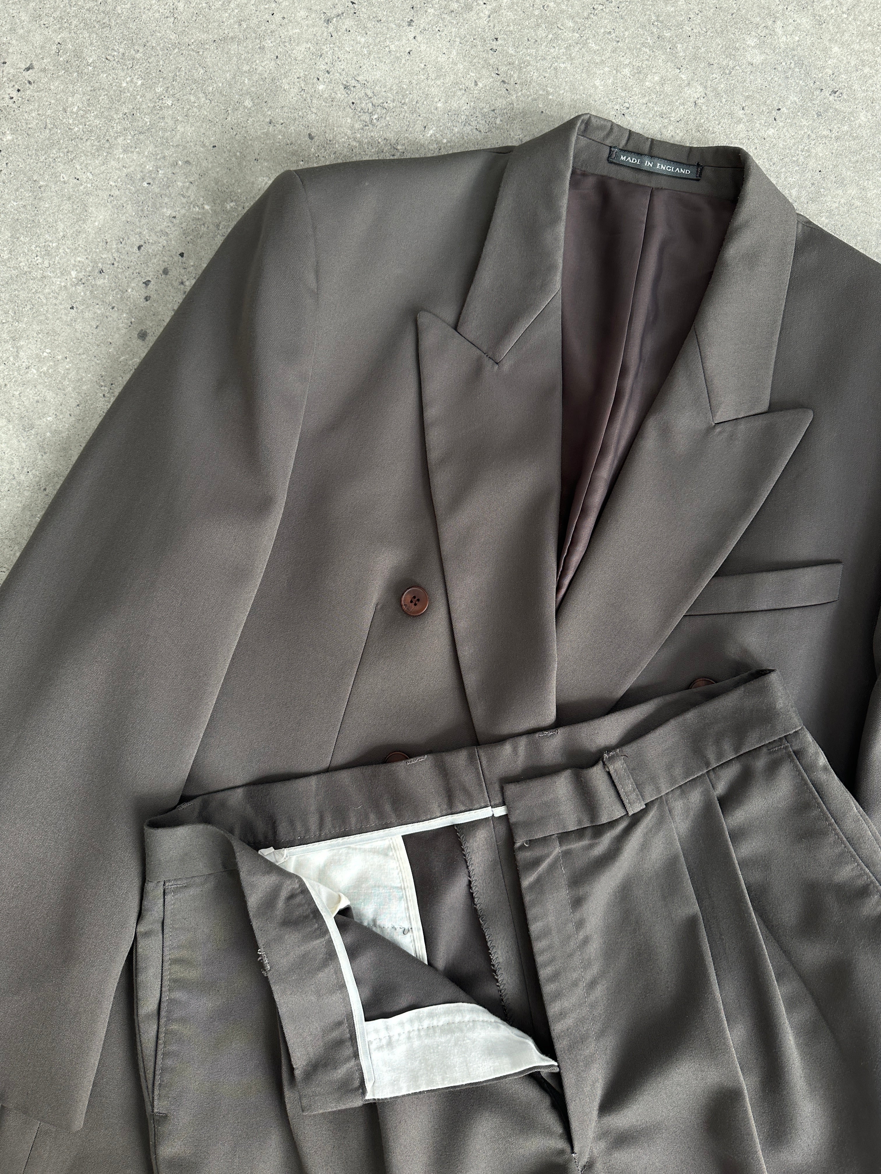 Vintage British double-breasted jumpsuit in size 40R/W32, classic vintage style with tailored fit and detailed lapel design.