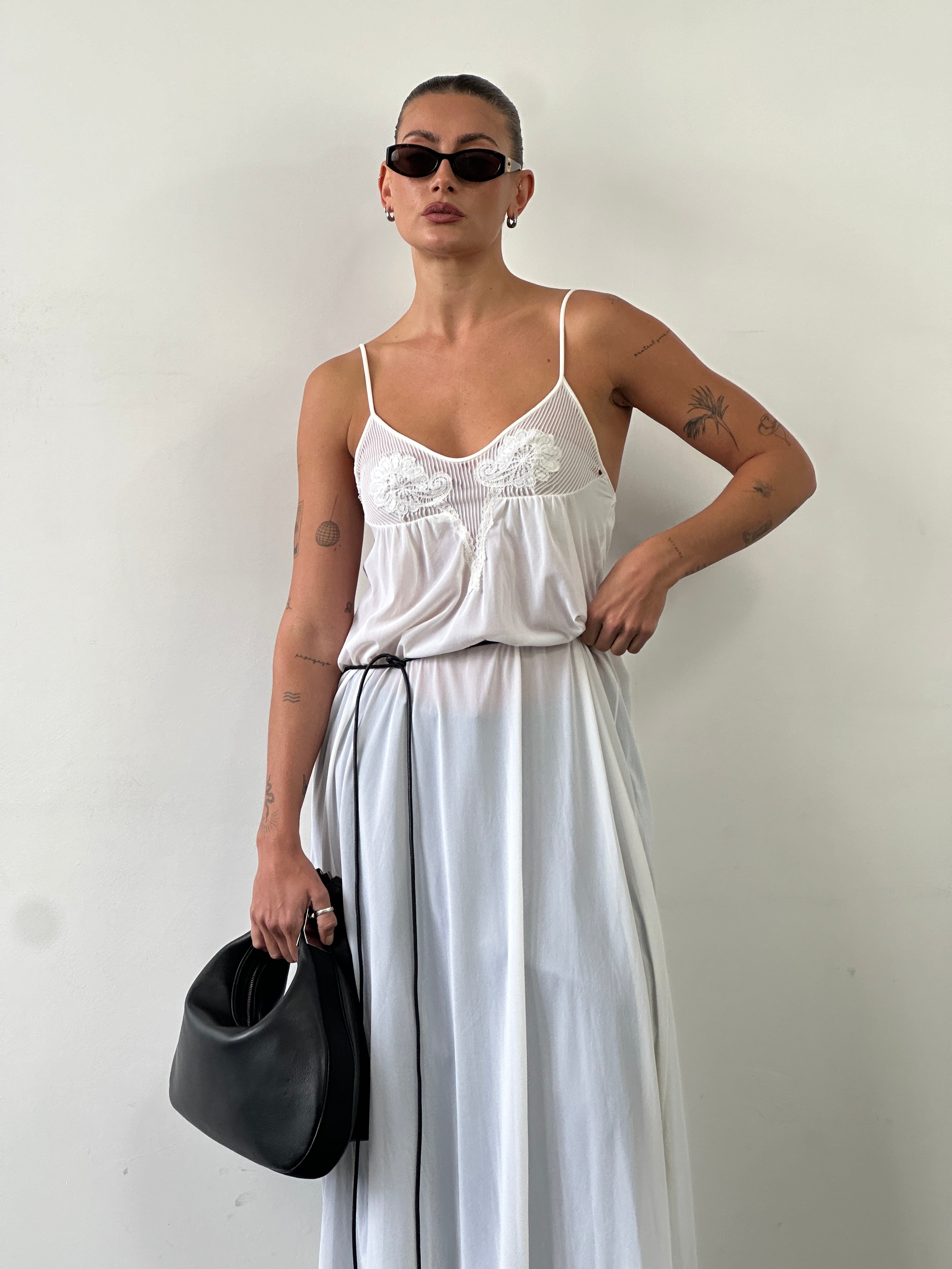 Vintage sheer maxi slip dress in size S/M, showcasing lightweight, flowing fabric with elegant, vintage-inspired design.