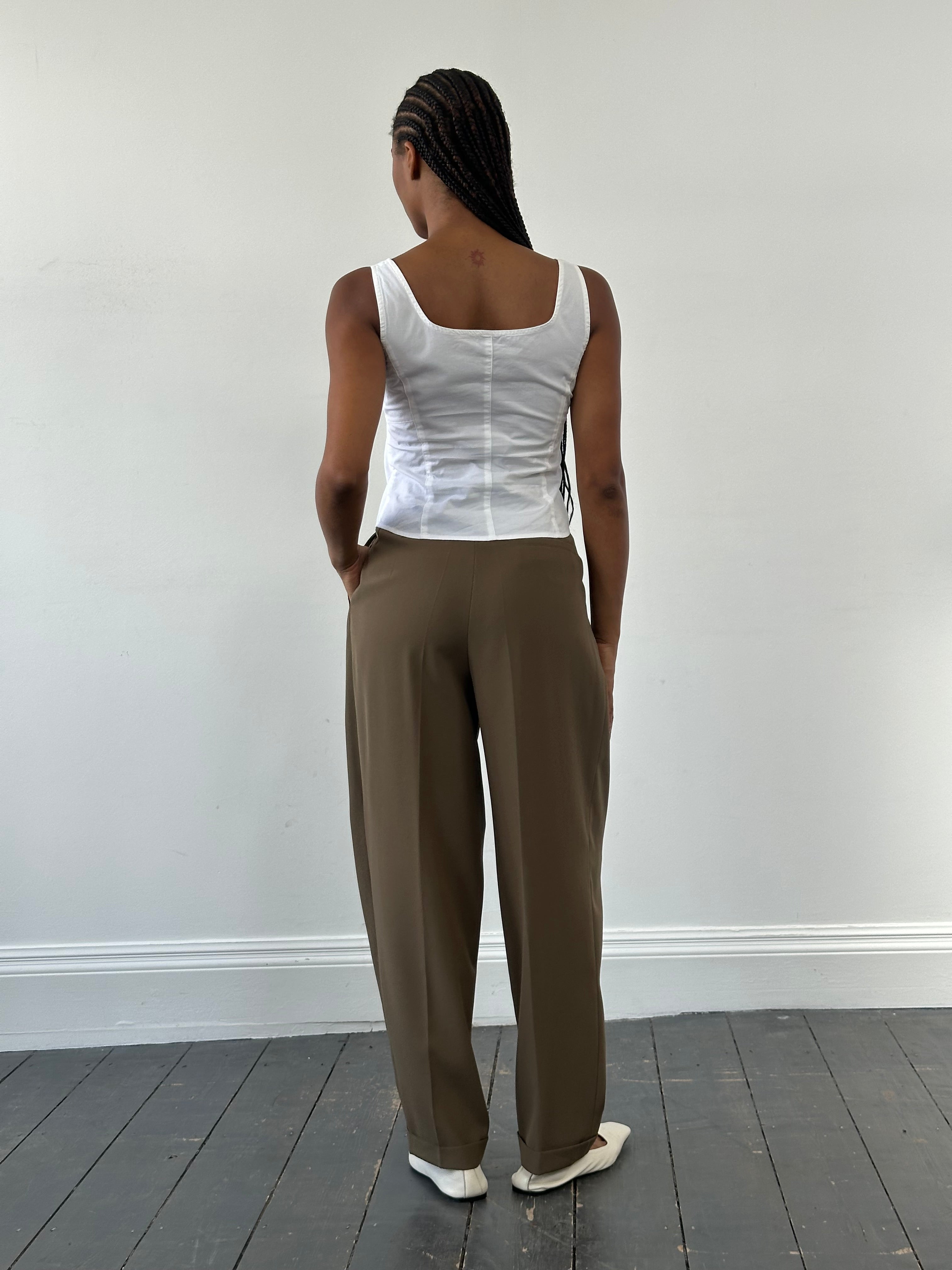 Vintage 1990s high waisted pleated tailored trousers in W28, showcasing classic vintage style and structured fit.