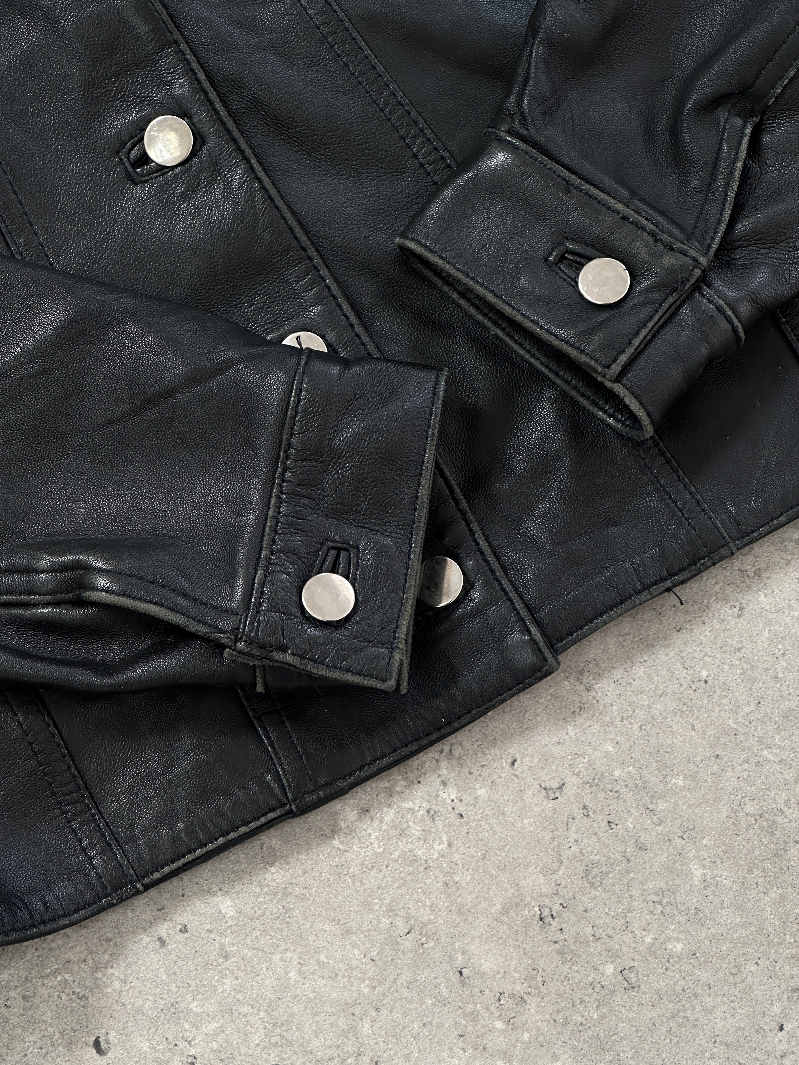 Vintage Italian leather jacket with button-up front, classic style, in S/M size, featuring a distressed brown leather finish.