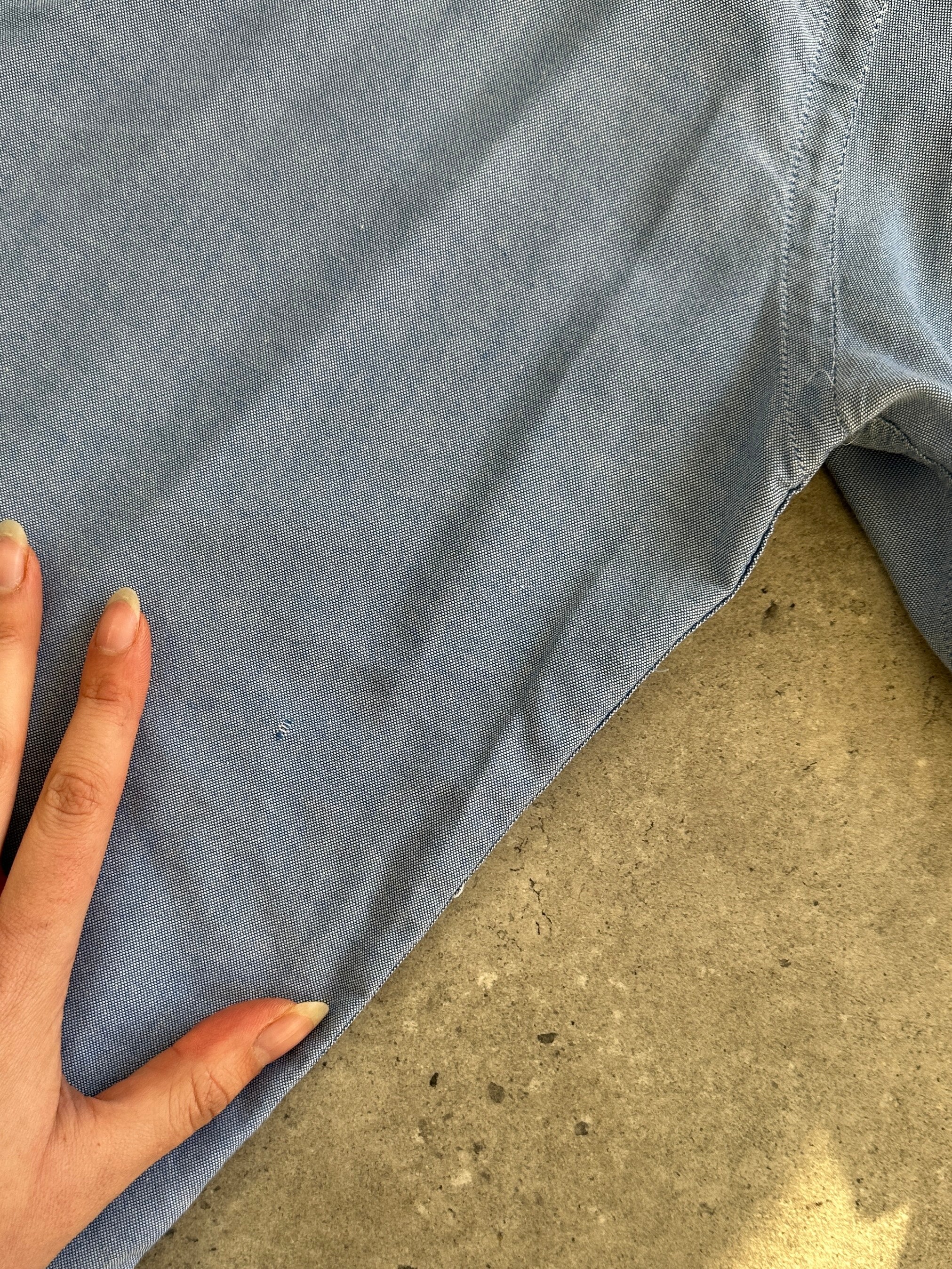 Valentino 1990s pure cotton logo shirt in XL, featuring classic design and brand logo on the front, laid flat.