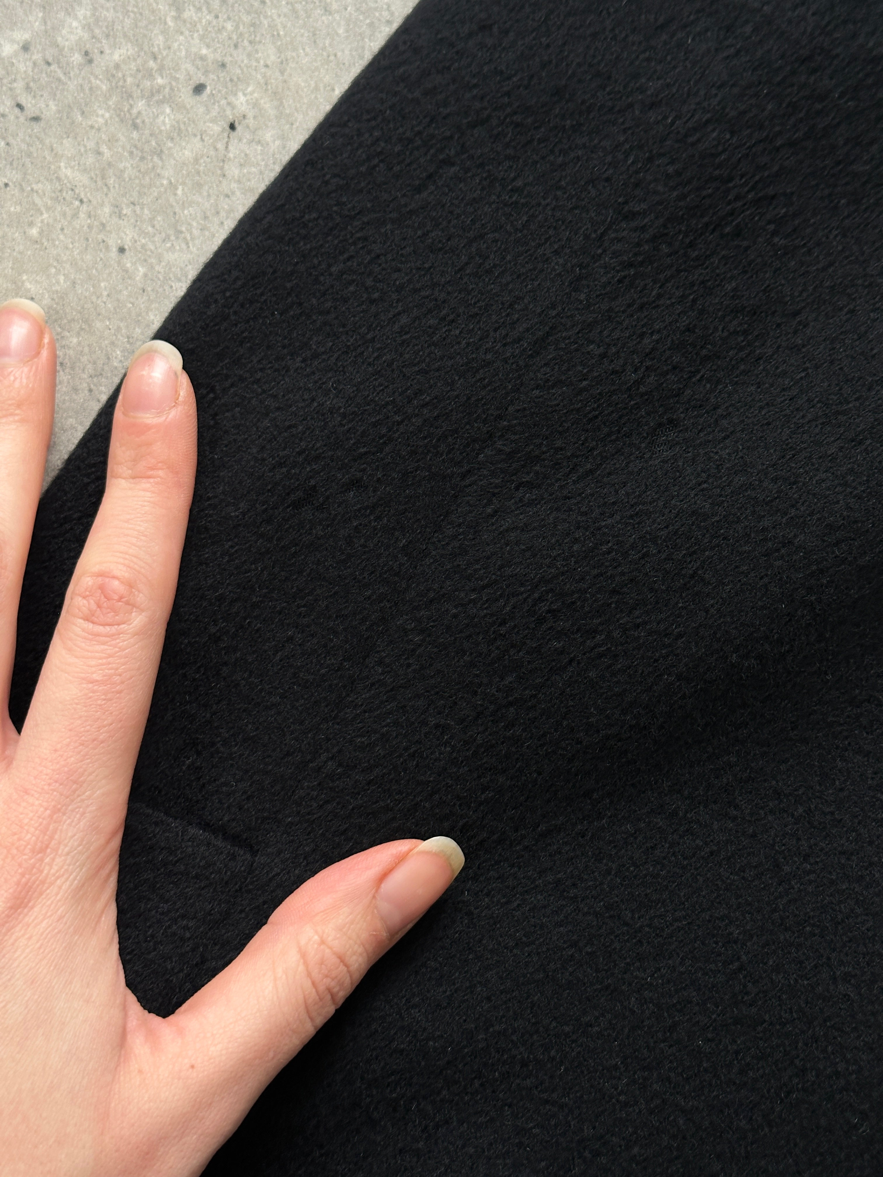 Givenchy 1990s pure wool coat with concealed placket, oversized fit, stylish vintage design, in a classic coat silhouette.