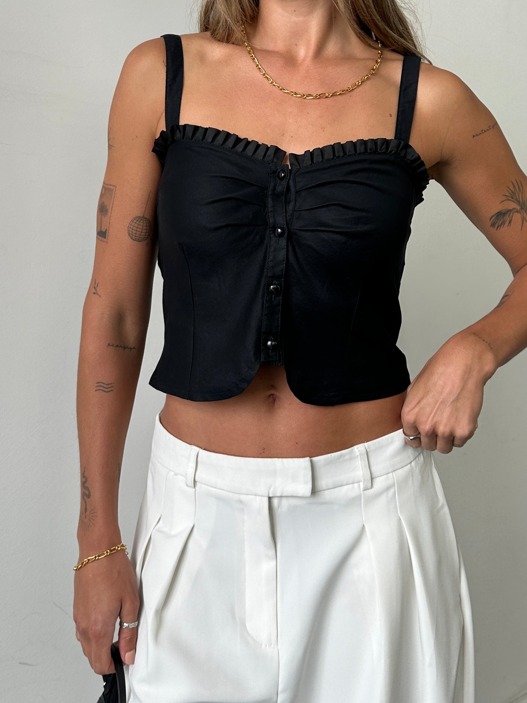 Vintage frill trim crop top in size small, featuring delicate ruffle details and lightweight fabric for a stylish, vintage-inspired look.