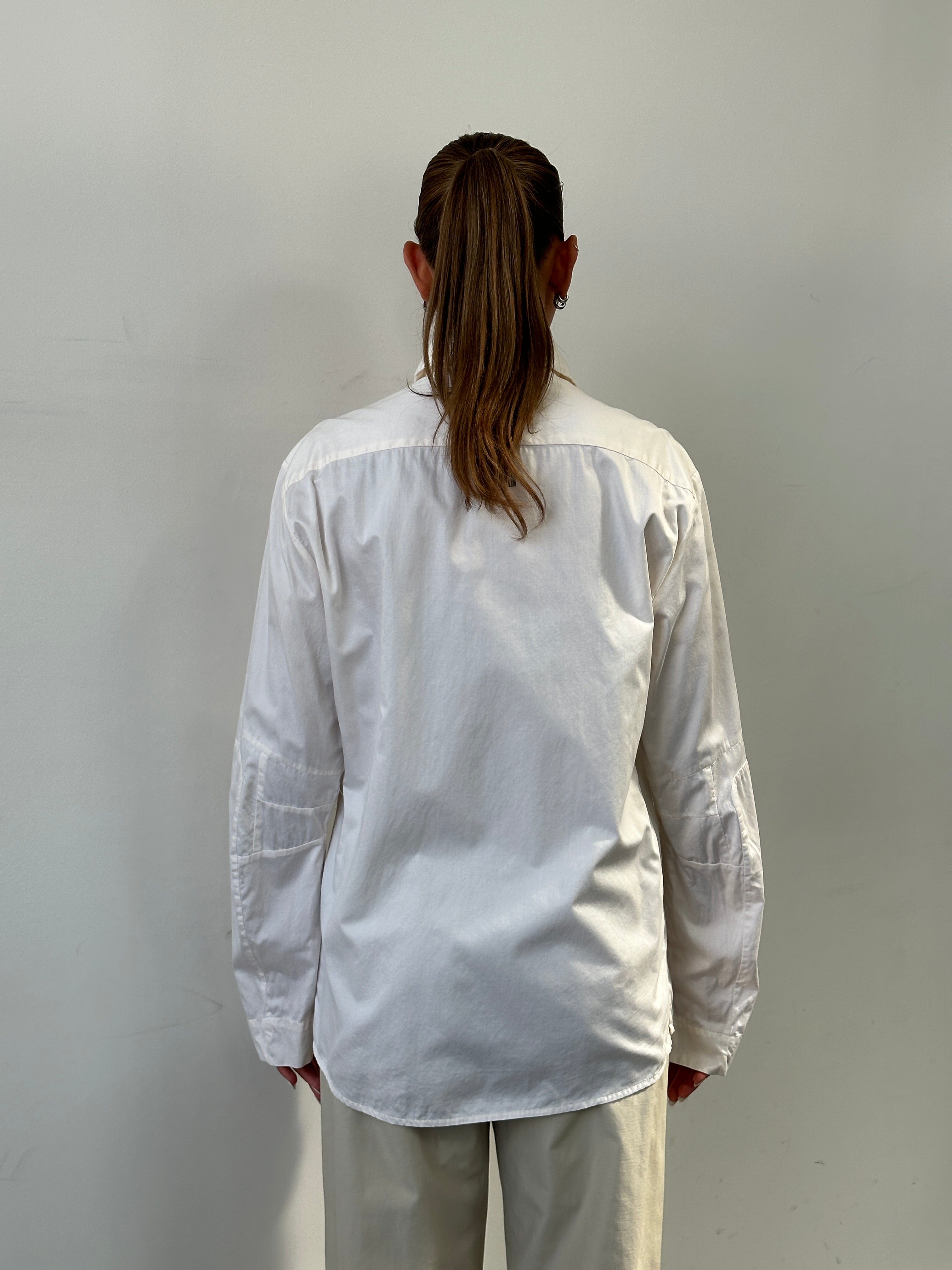 Versace Sport 90s pure cotton shirt in size L, featuring classic design and soft fabric, displayed on a hanger.