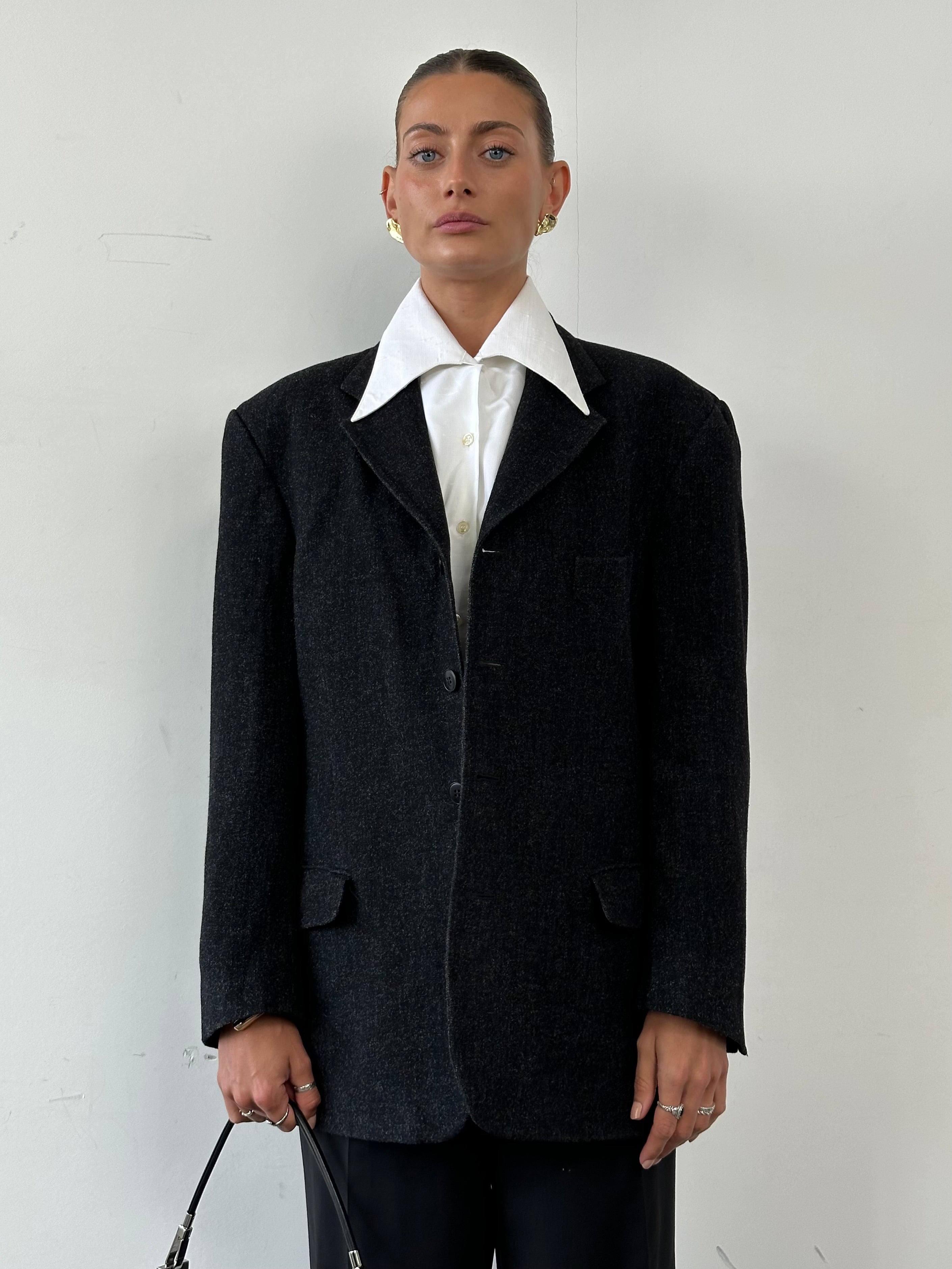 Yves Saint Laurent Pour Homme brushed wool blazer in size large to extra large, tailored fit with classic lapel and button closure.