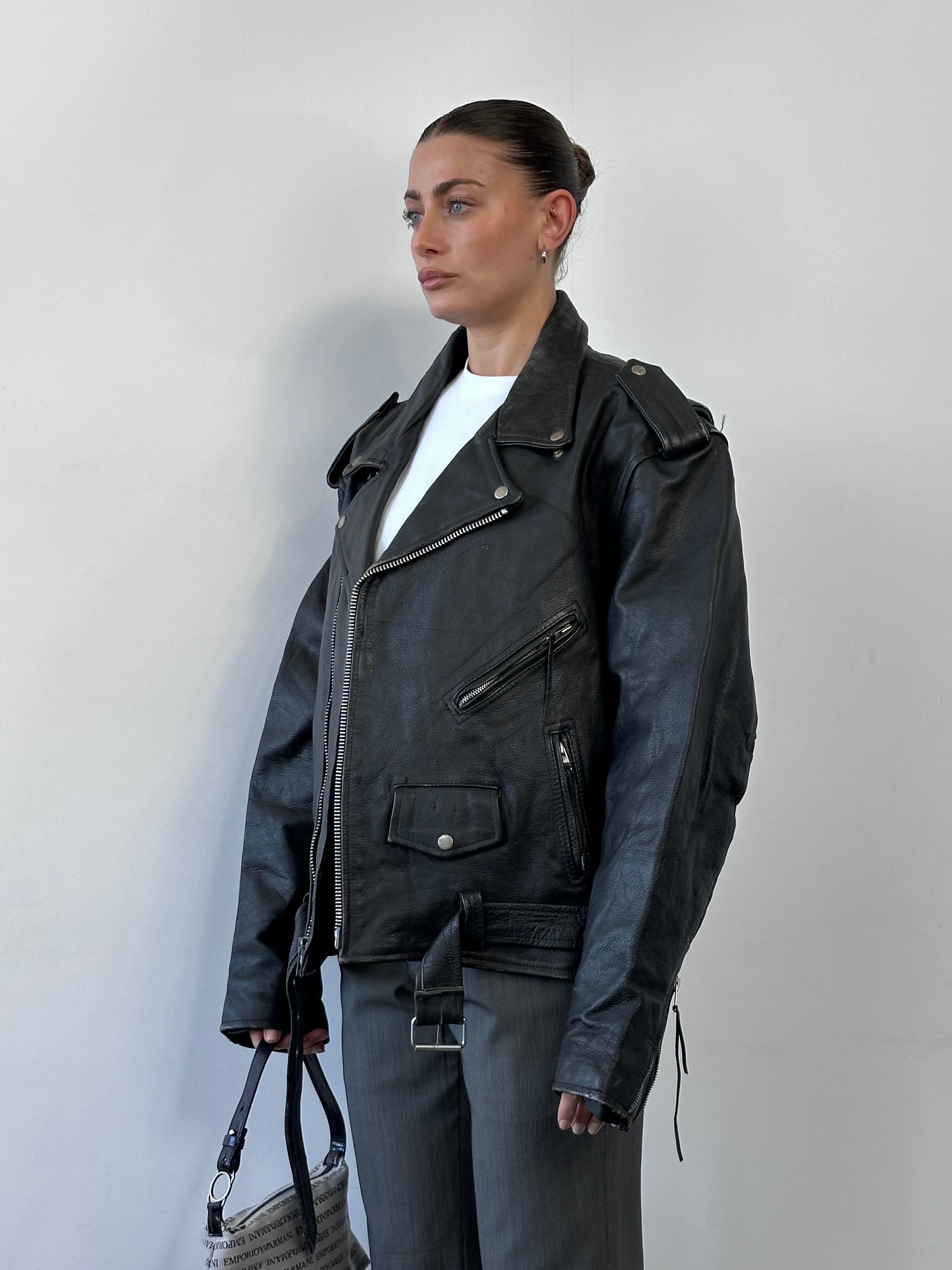 Vintage Leather Biker Jacket in XL, showcasing classic design with rugged leather and detailed stitching.