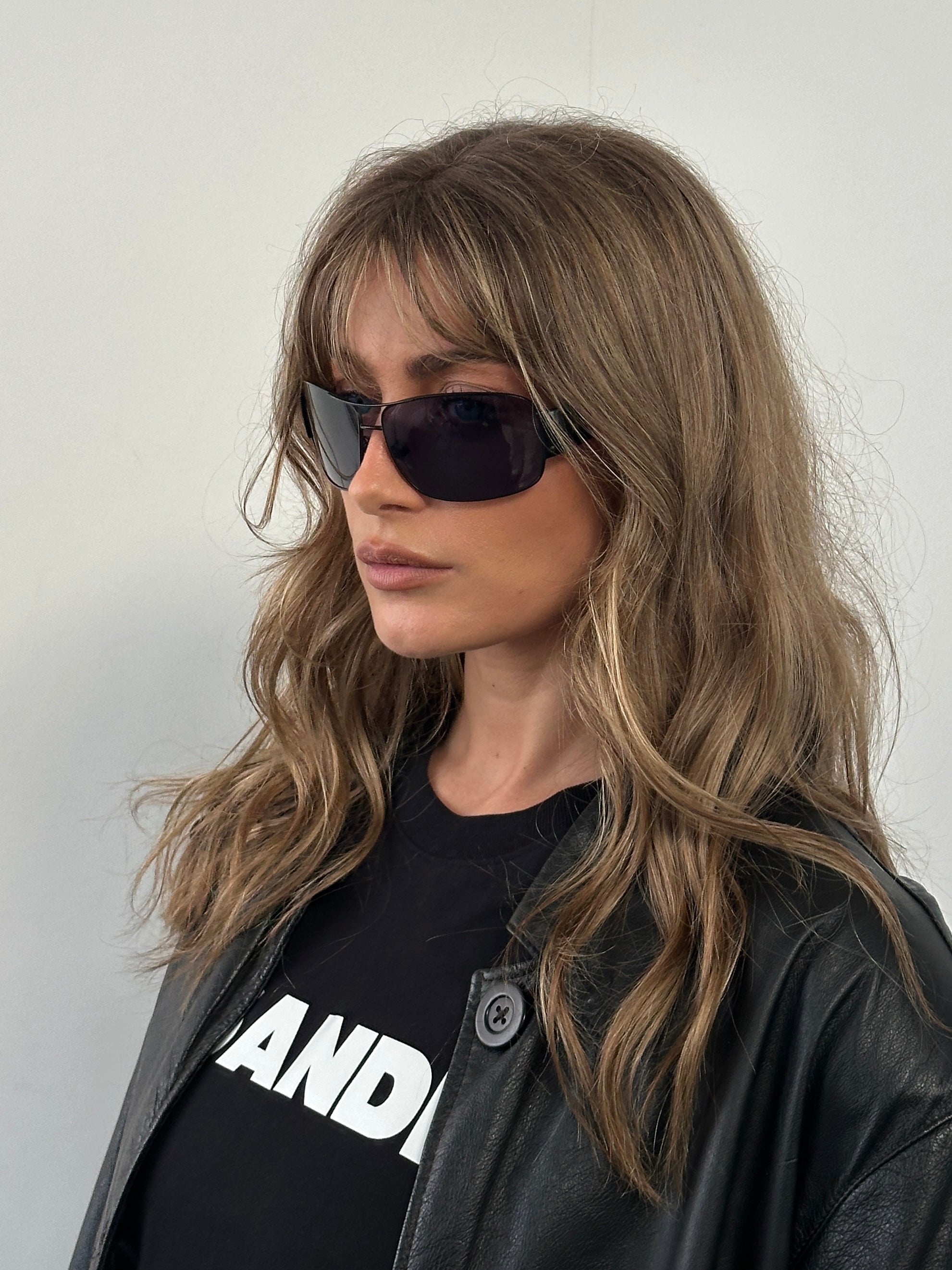 Prada aviator shield sunglasses with dark tinted lenses and metal frame, stylish and protective eyewear for sun protection.