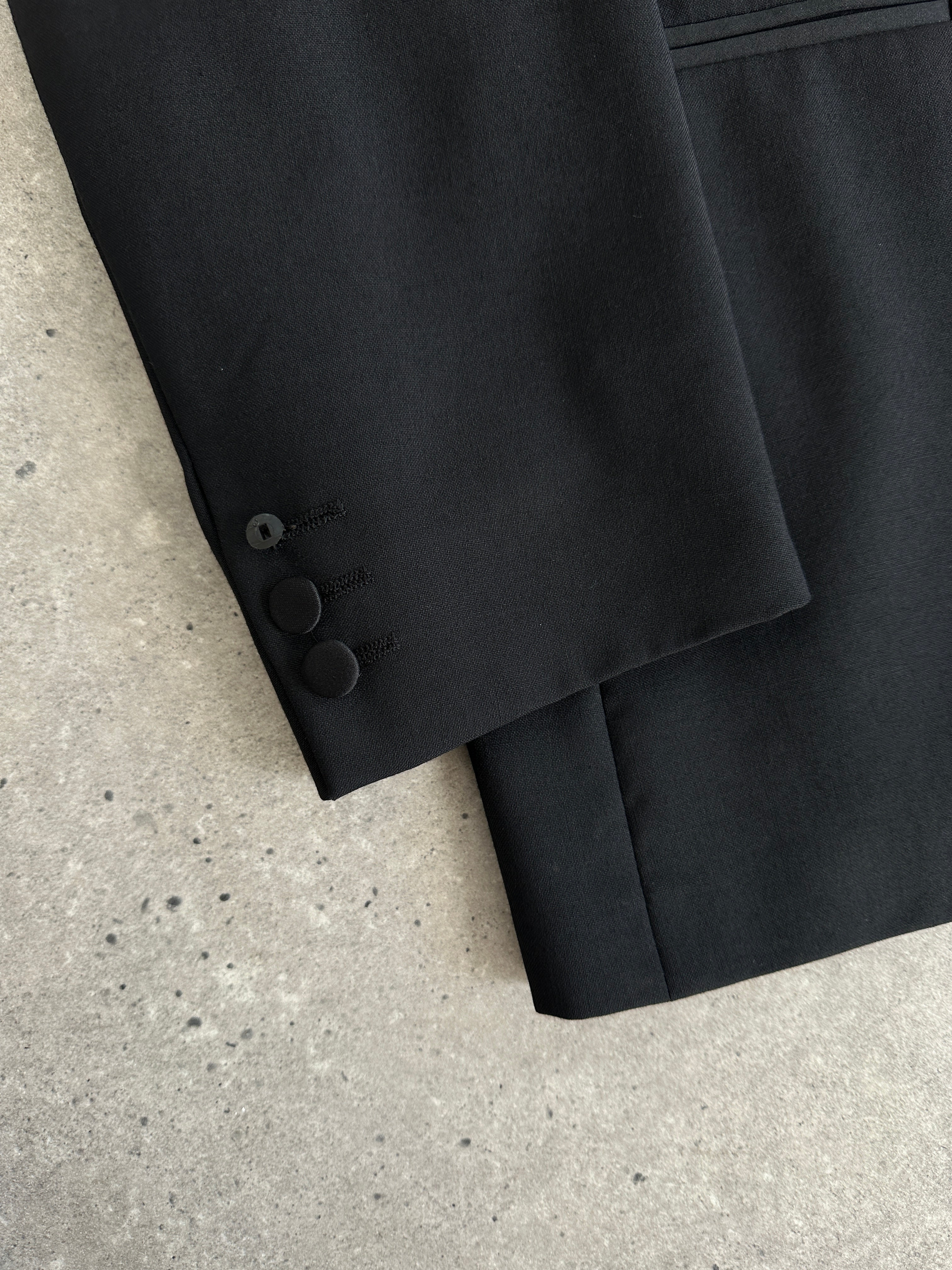 Jaeger tuxedo suit with double-breasted design, pure wool fabric, in size 42R/W28, shown on a hanger with a tailored fit.