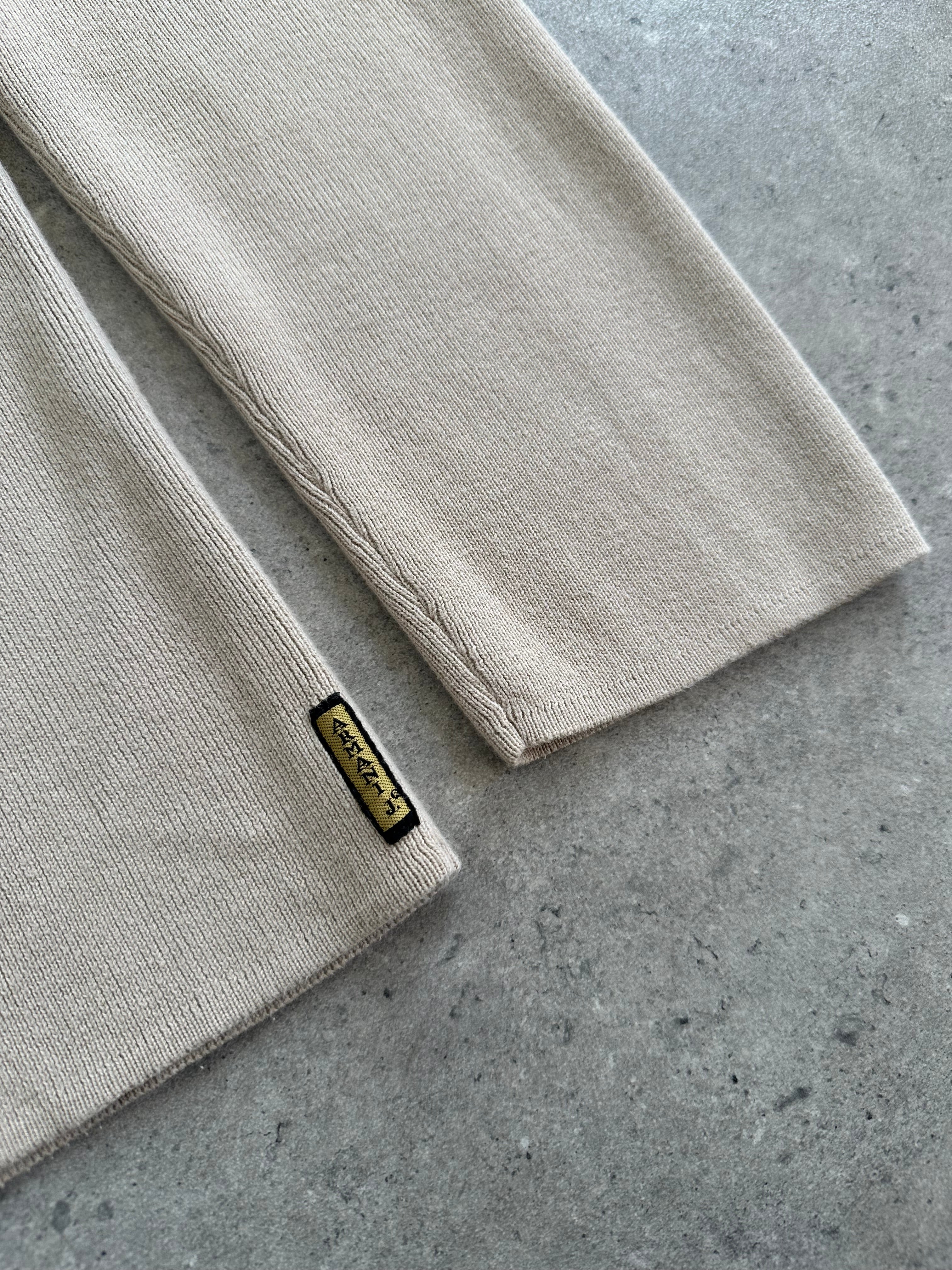 Armani Jeans pure cotton V-neck jumper in size L, featuring a classic design and soft fabric, displayed on a neutral background.
