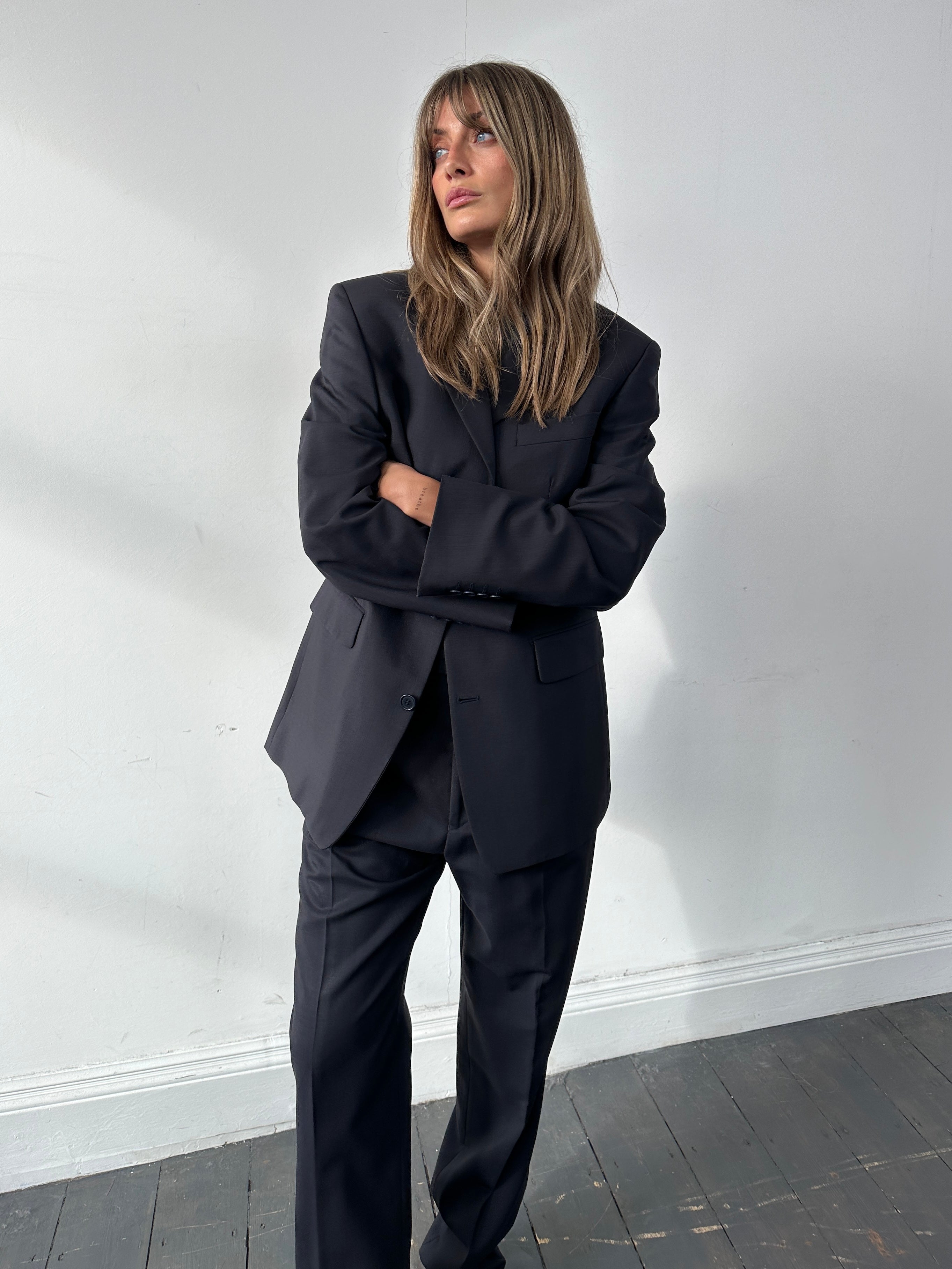 Yves Saint Laurent Pour Homme wool single-breasted suit in size 38R/W30, displayed as a tailored jumpsuit with lapels and buttons.