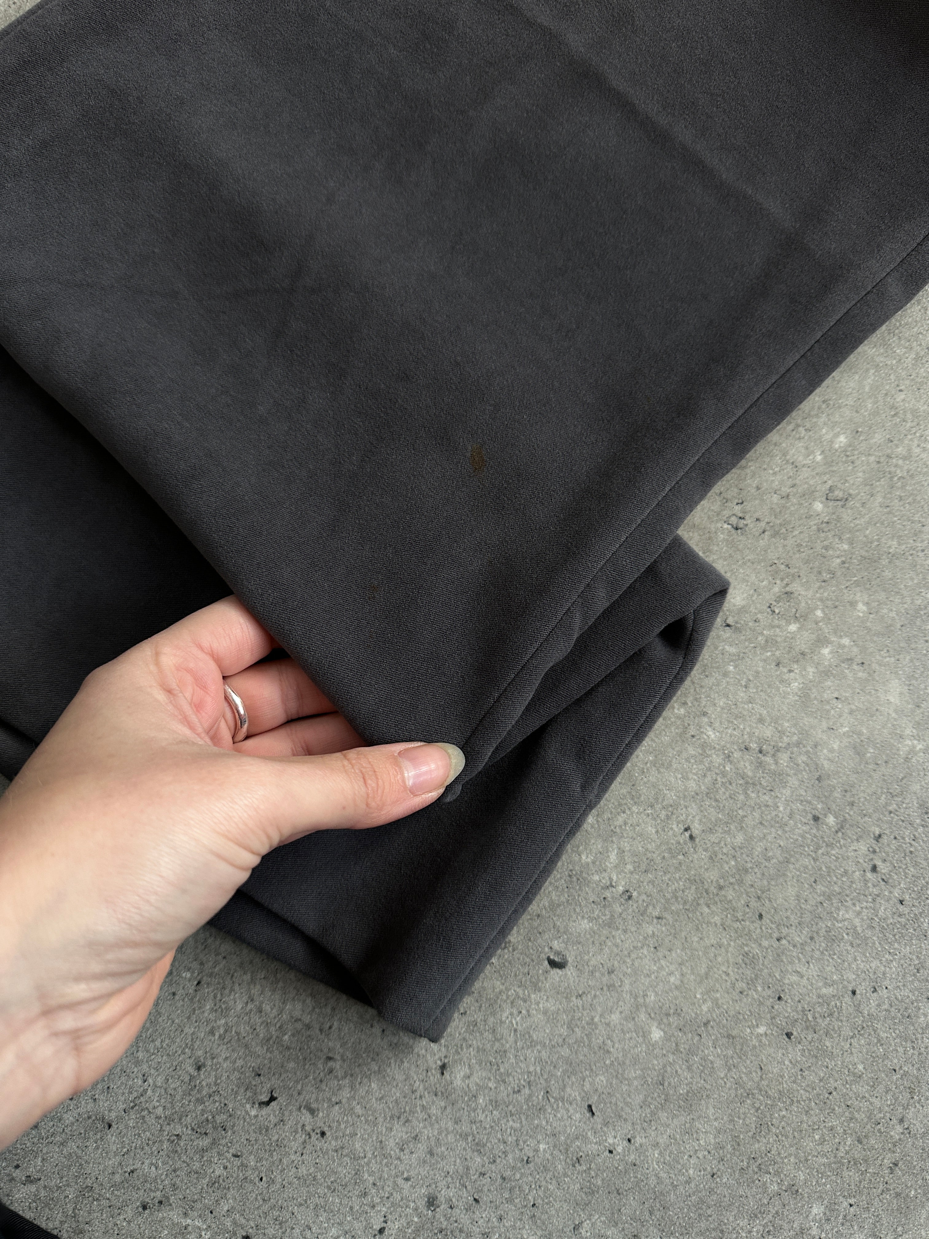 Emporio Armani wide-leg low-rise trousers in dark fabric, shown on a model with a relaxed fit and stylish design.
