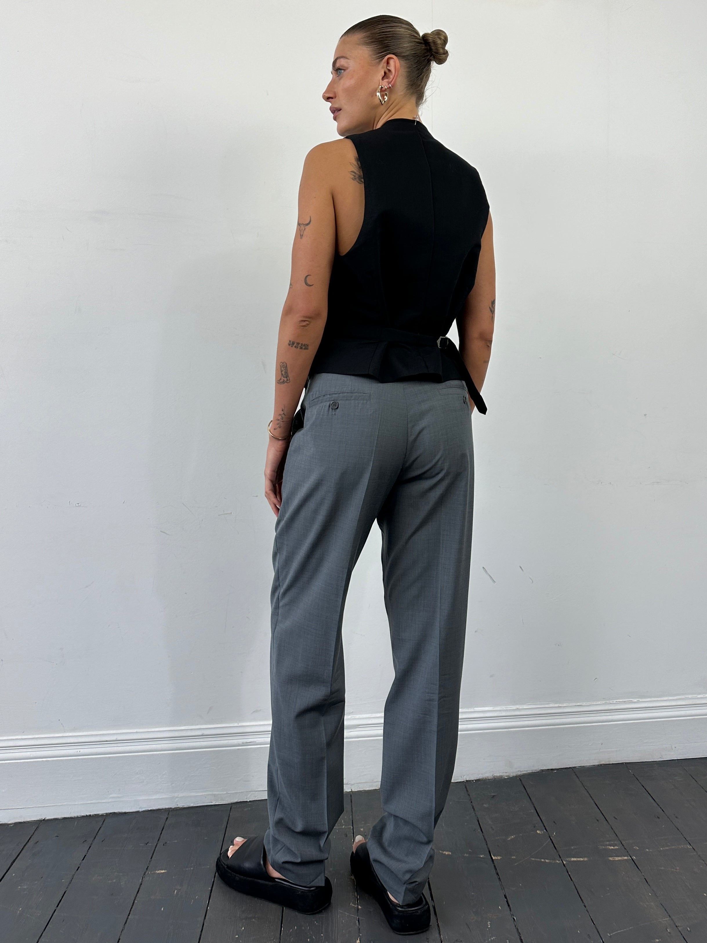 Emporio Armani high waisted tailored wool trousers in dark color, front view showing sleek design and classic fit.