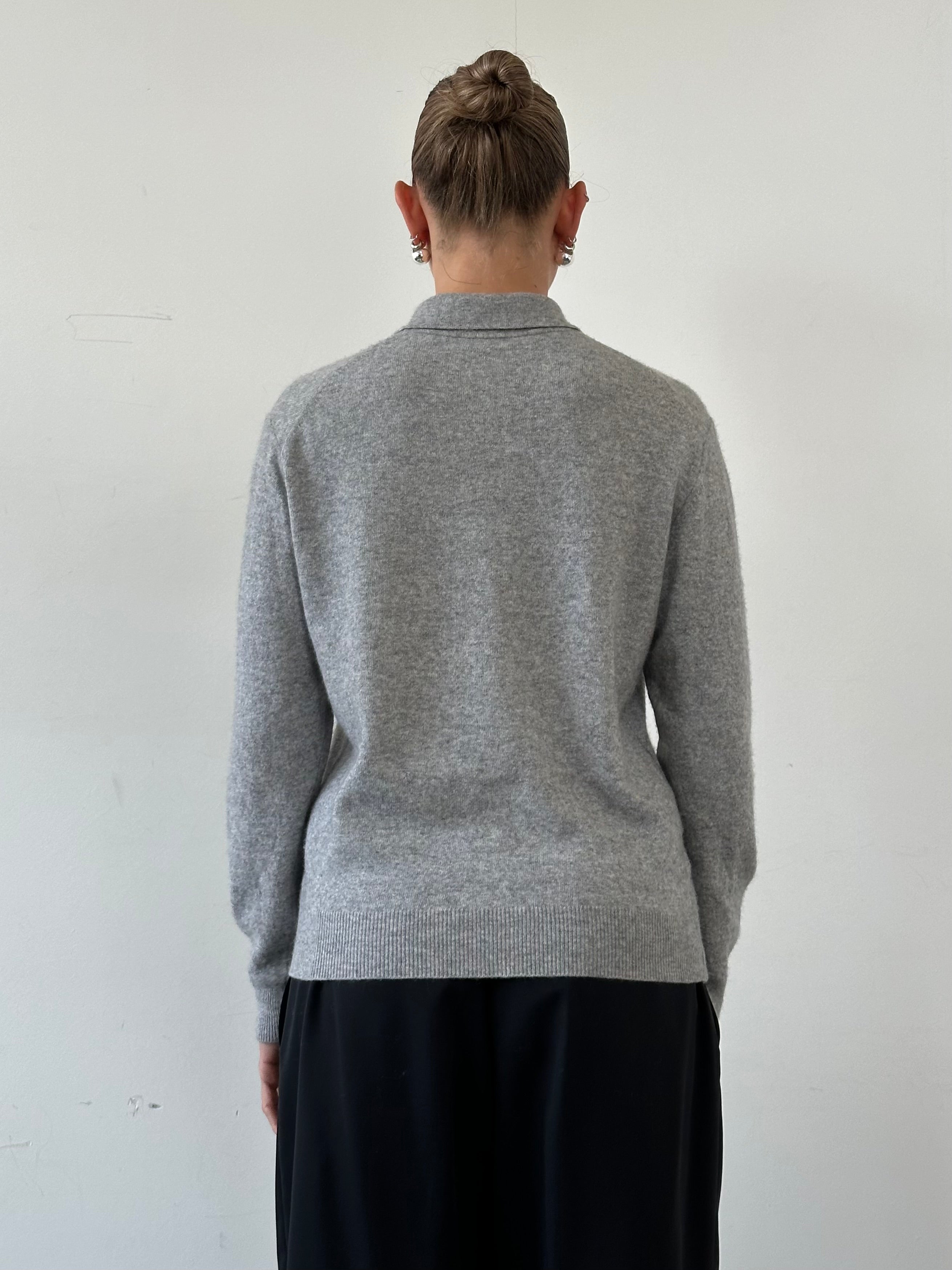 Vintage men's merino wool cashmere polo jumper in size M, featuring a classic knit design and ribbed collar.
