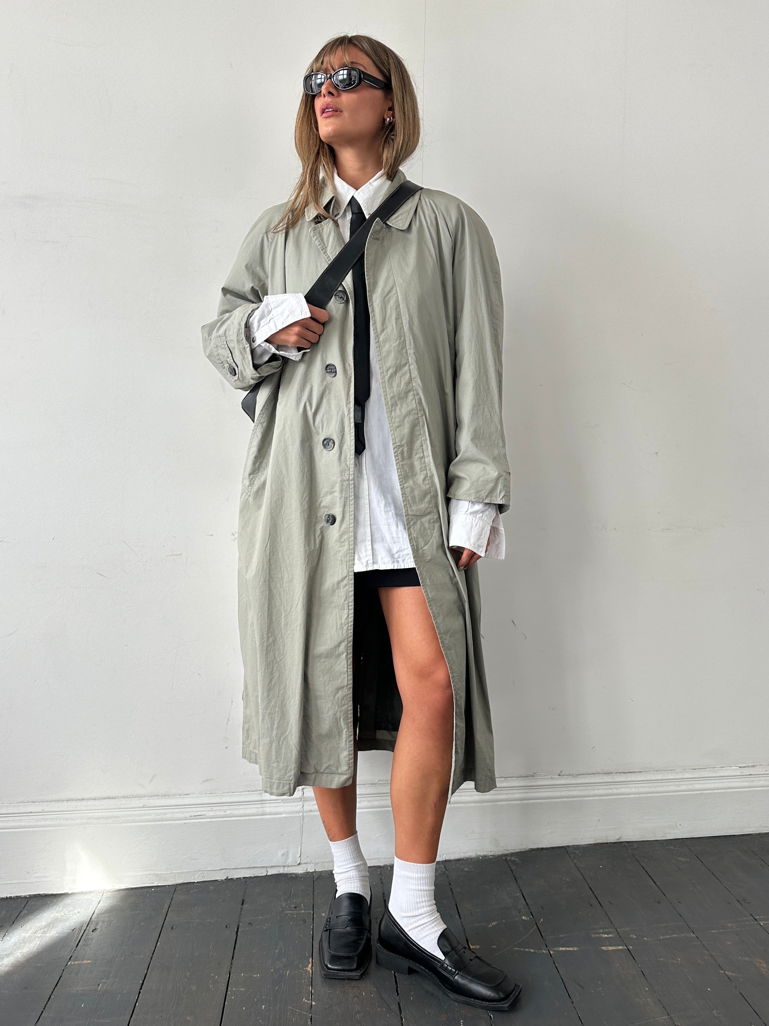 Christian Dior Le Connaisseur belted trench coat in size M, stylish beige coat with classic design and belt detail.