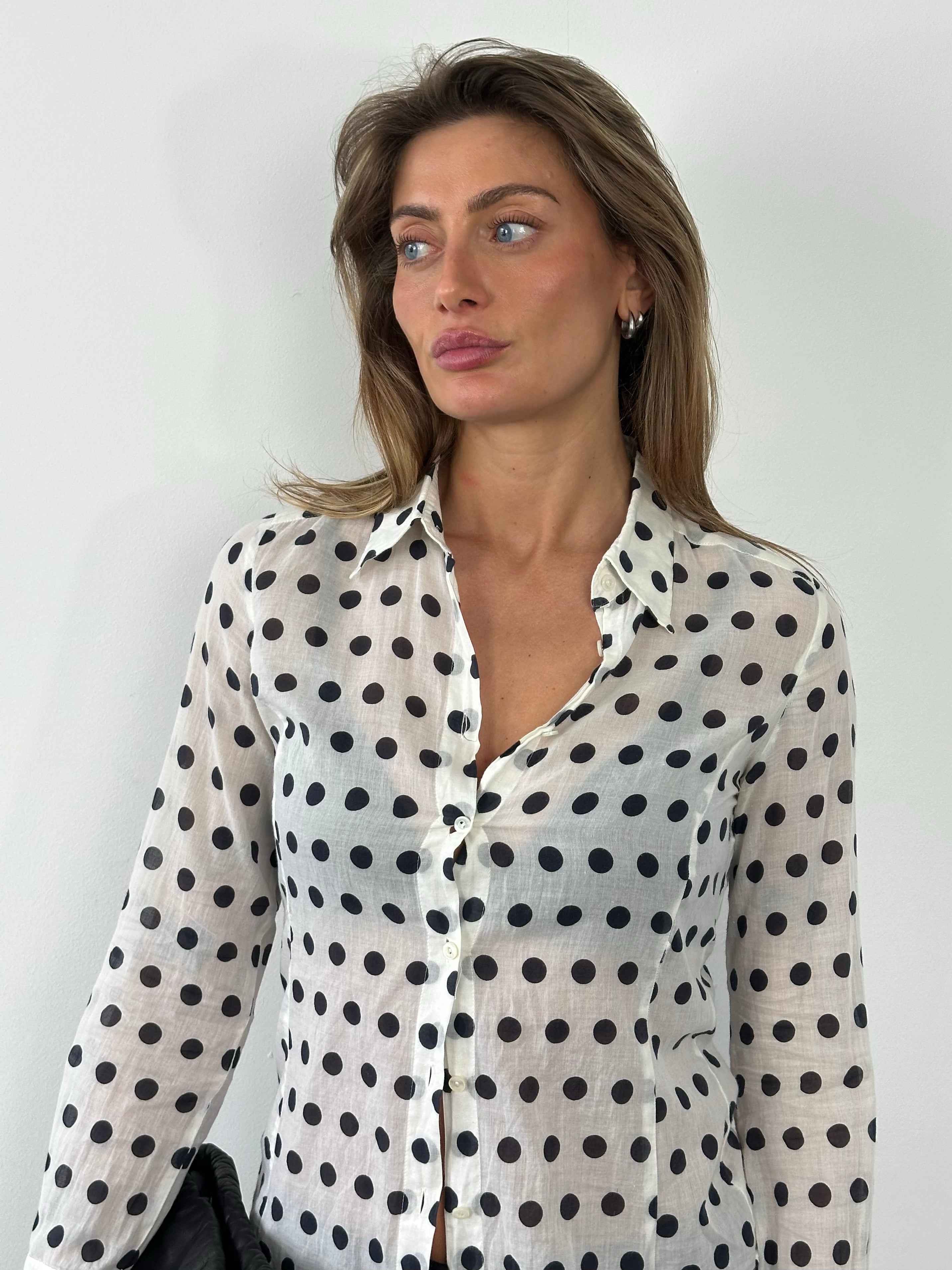 Marella 2000s pure cotton polka dot shirt in white with black dots, long sleeves, and classic collar, displayed on a hanger.