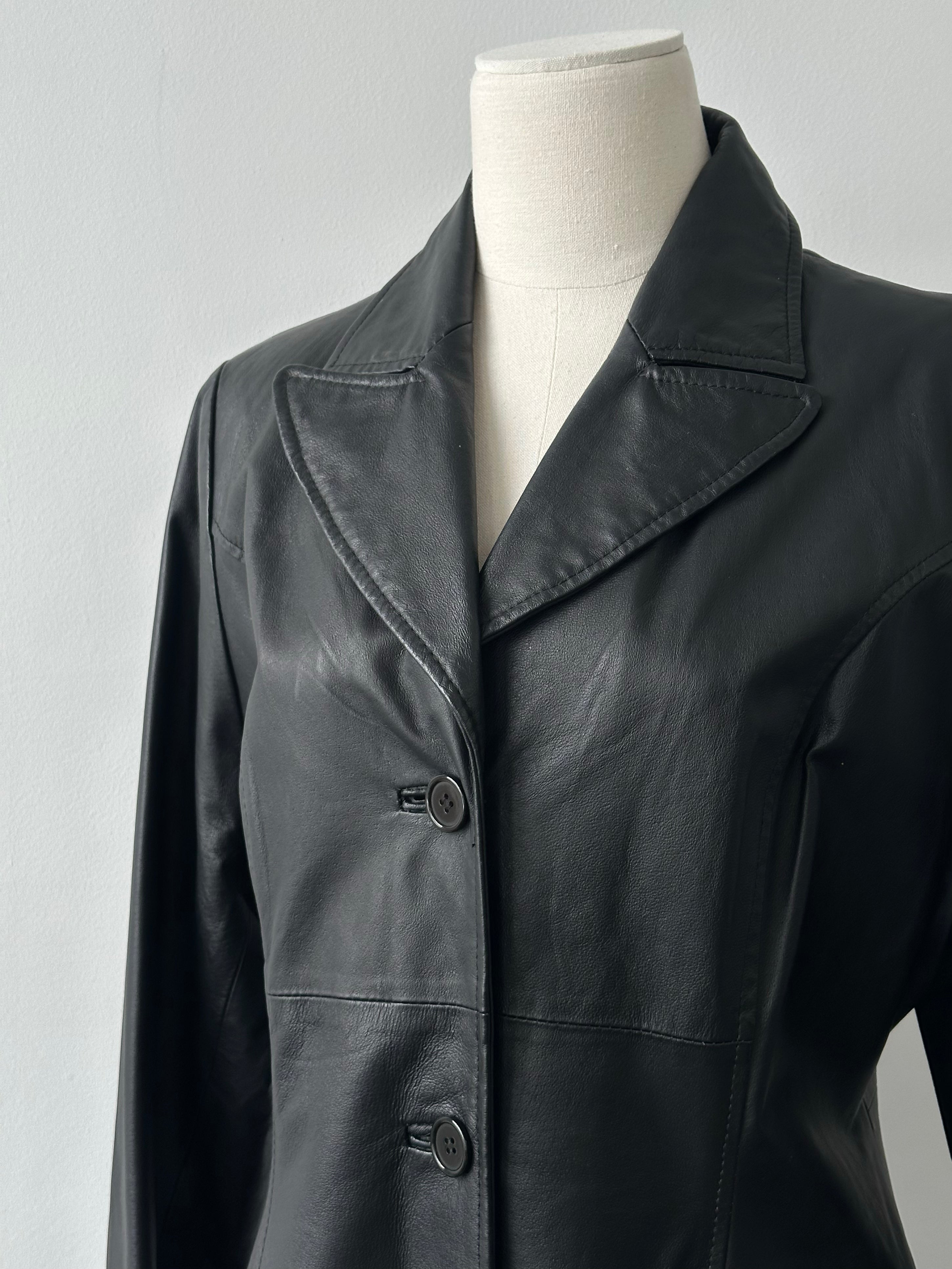 Vintage 1980s leather trench coat, floor length, size M, showcasing classic design and rich brown leather fabric.