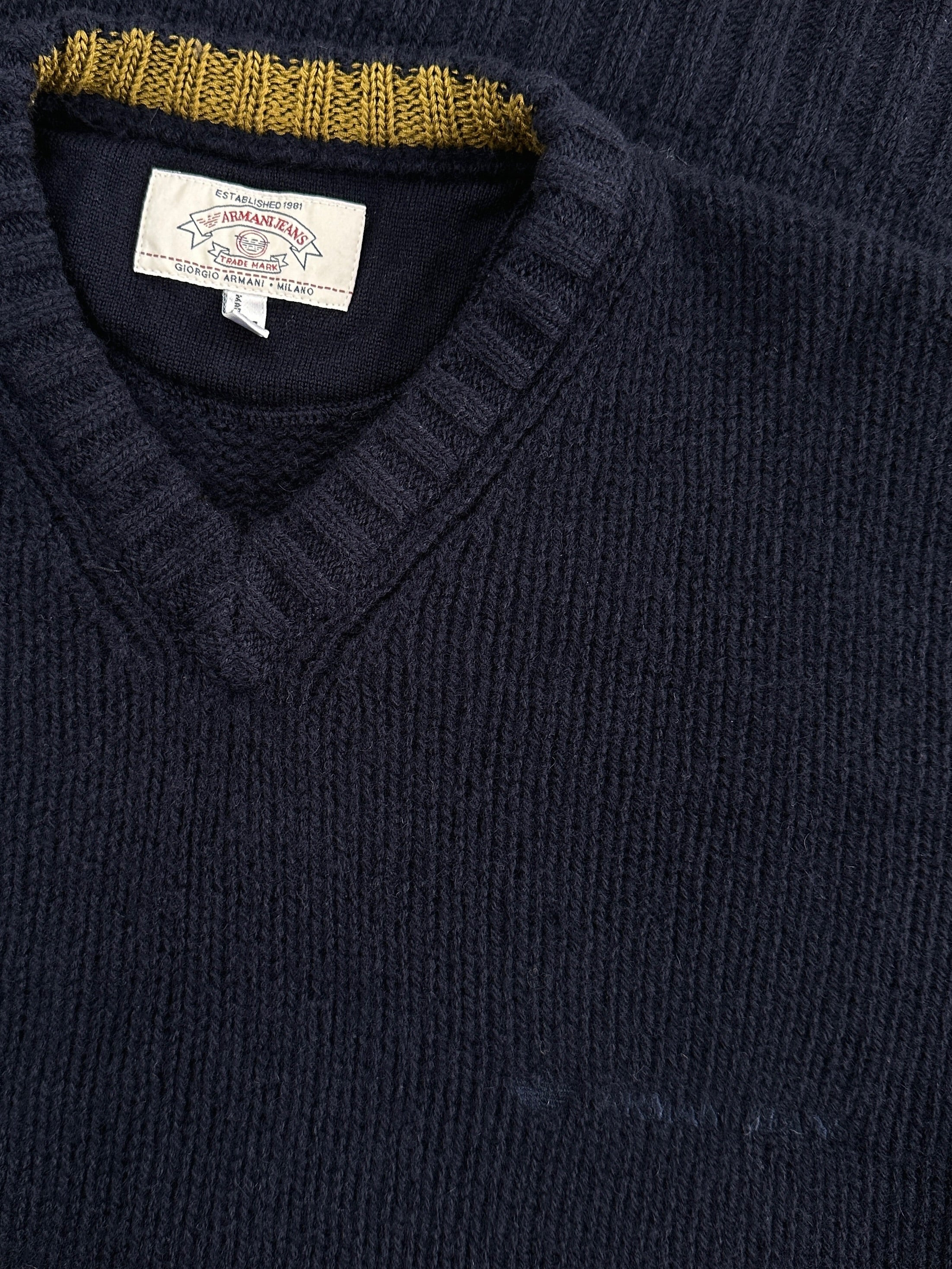 Armani Jeans 1990s pure wool knitted logo jumper in size L/XL, featuring a classic design and the brand's signature logo detail.