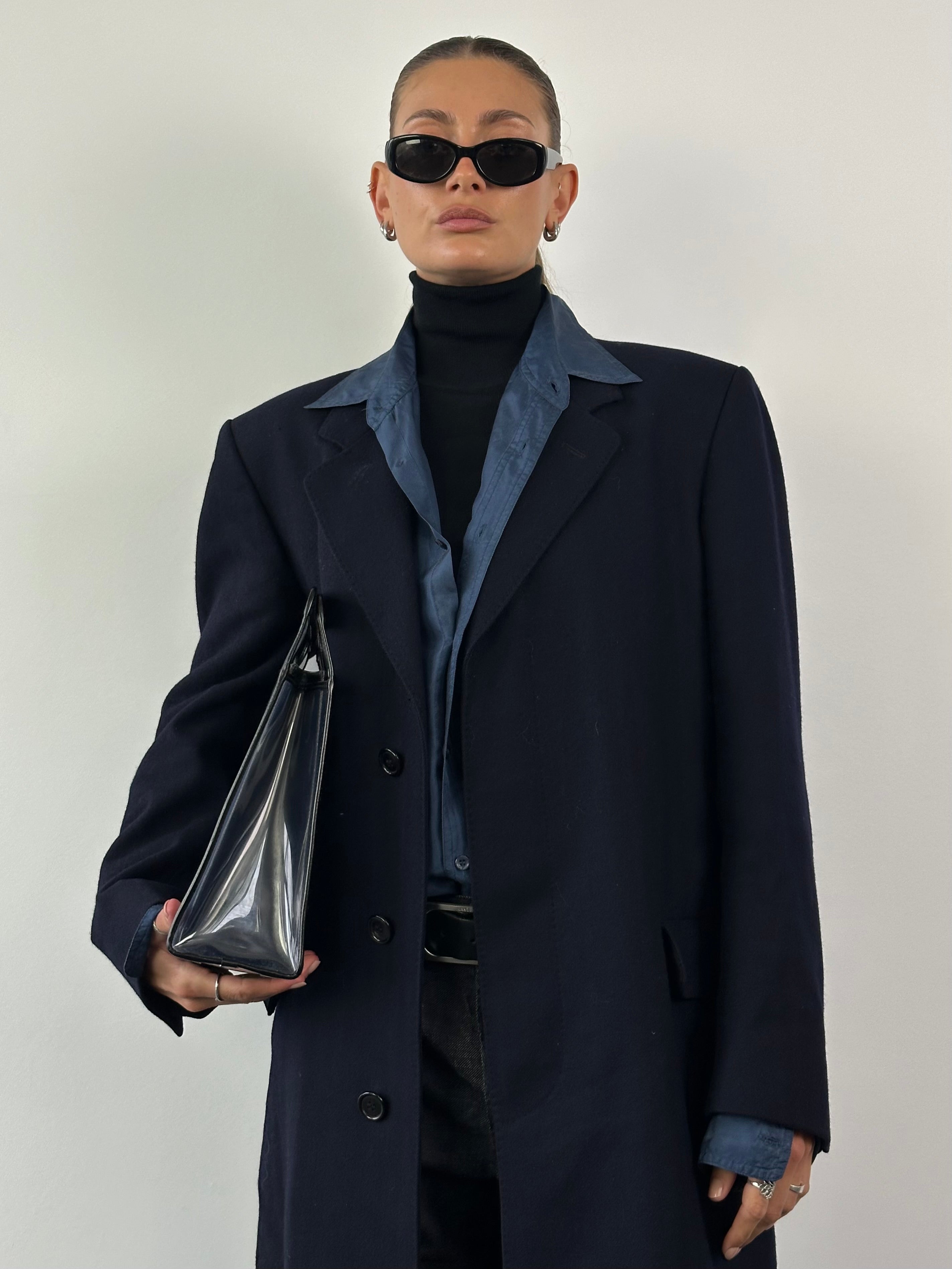 Christian Dior XL wool coat featuring a concealed placket and classic design, shown on a neutral background.