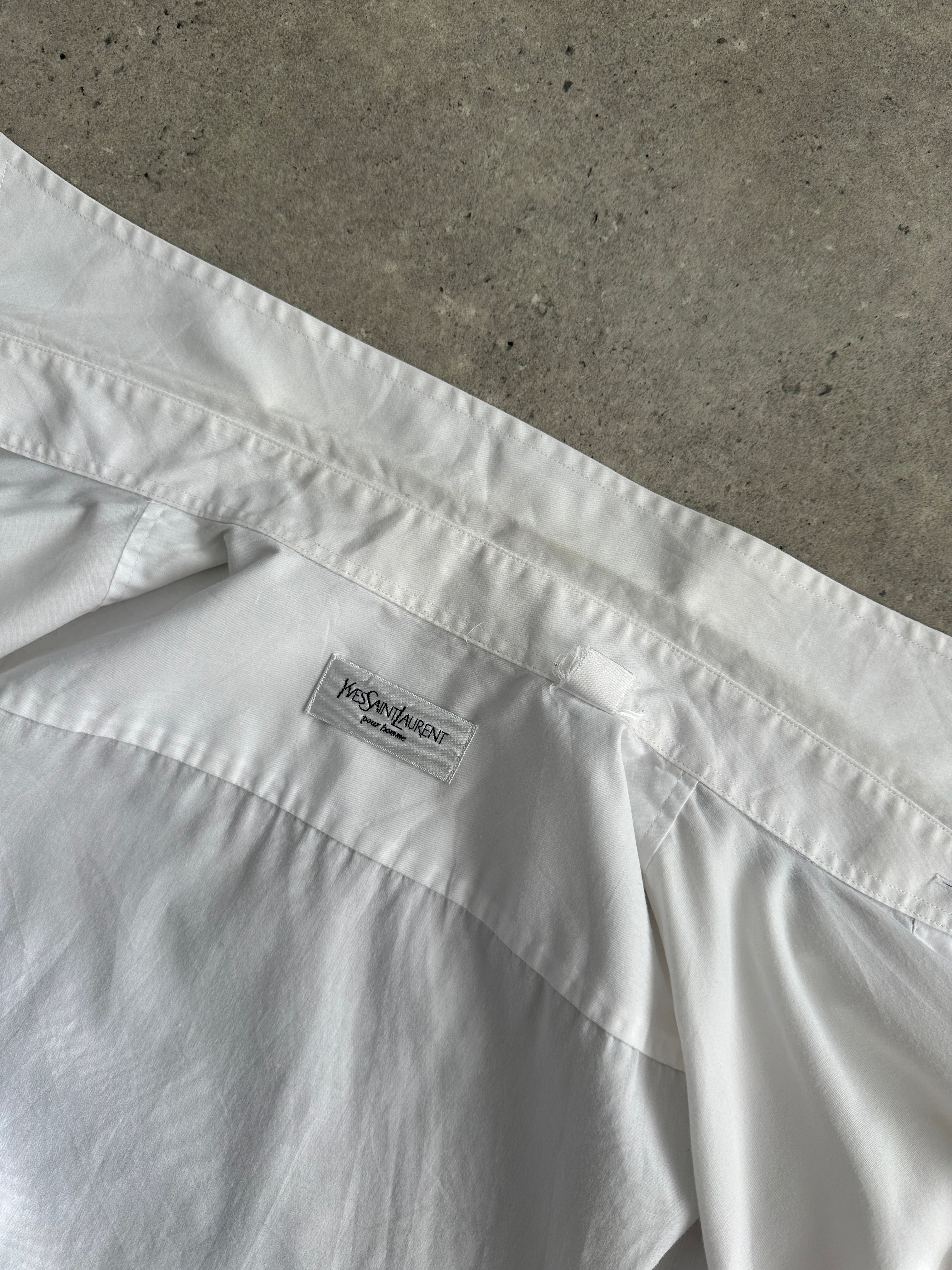 Yves Saint Laurent Pour Homme cotton short sleeve logo shirt in size L, featuring classic design and YSL branding on the chest.