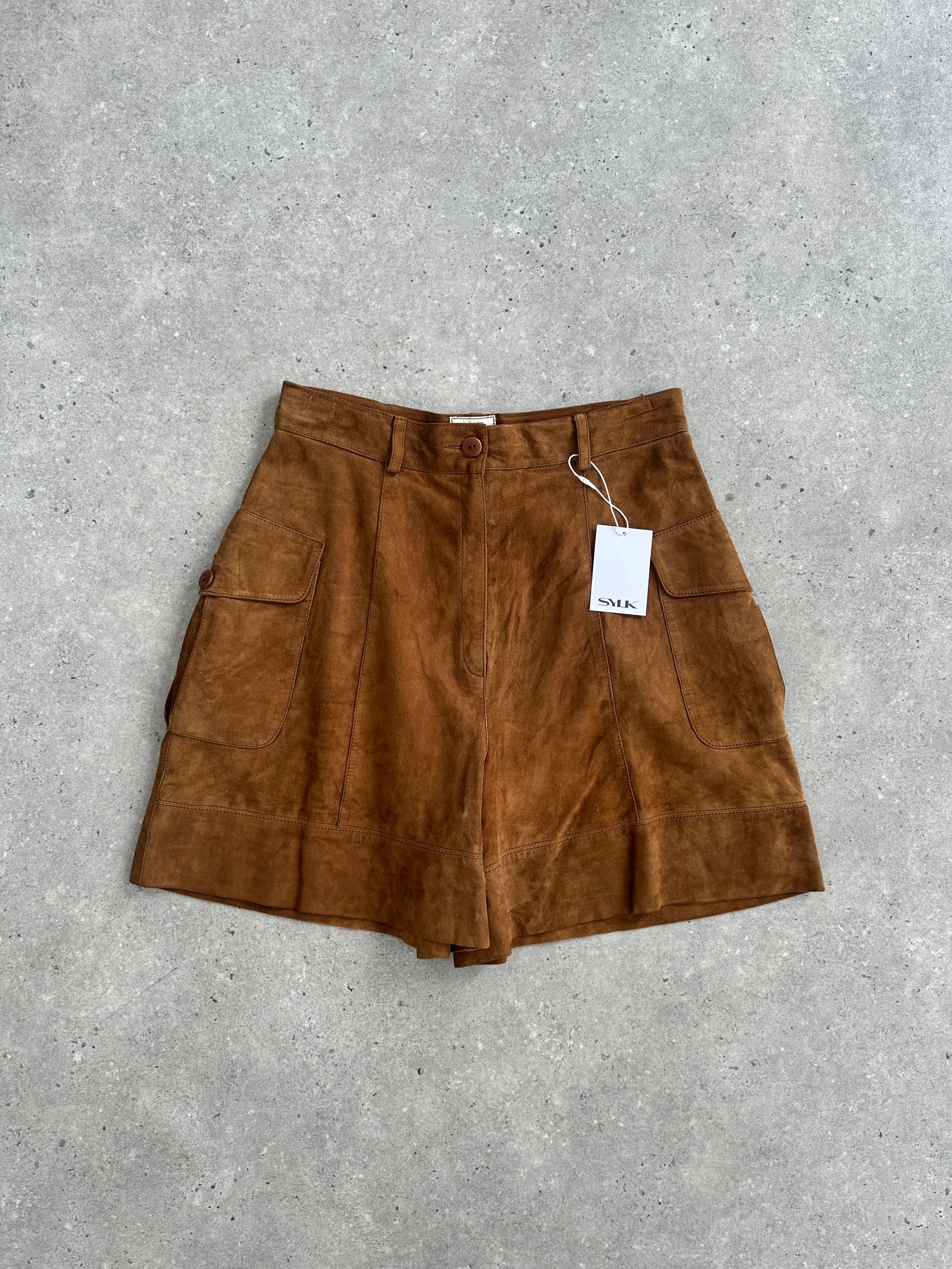 Vintage Italian high waisted suede leather shorts with a classic fit, displayed on a neutral background.