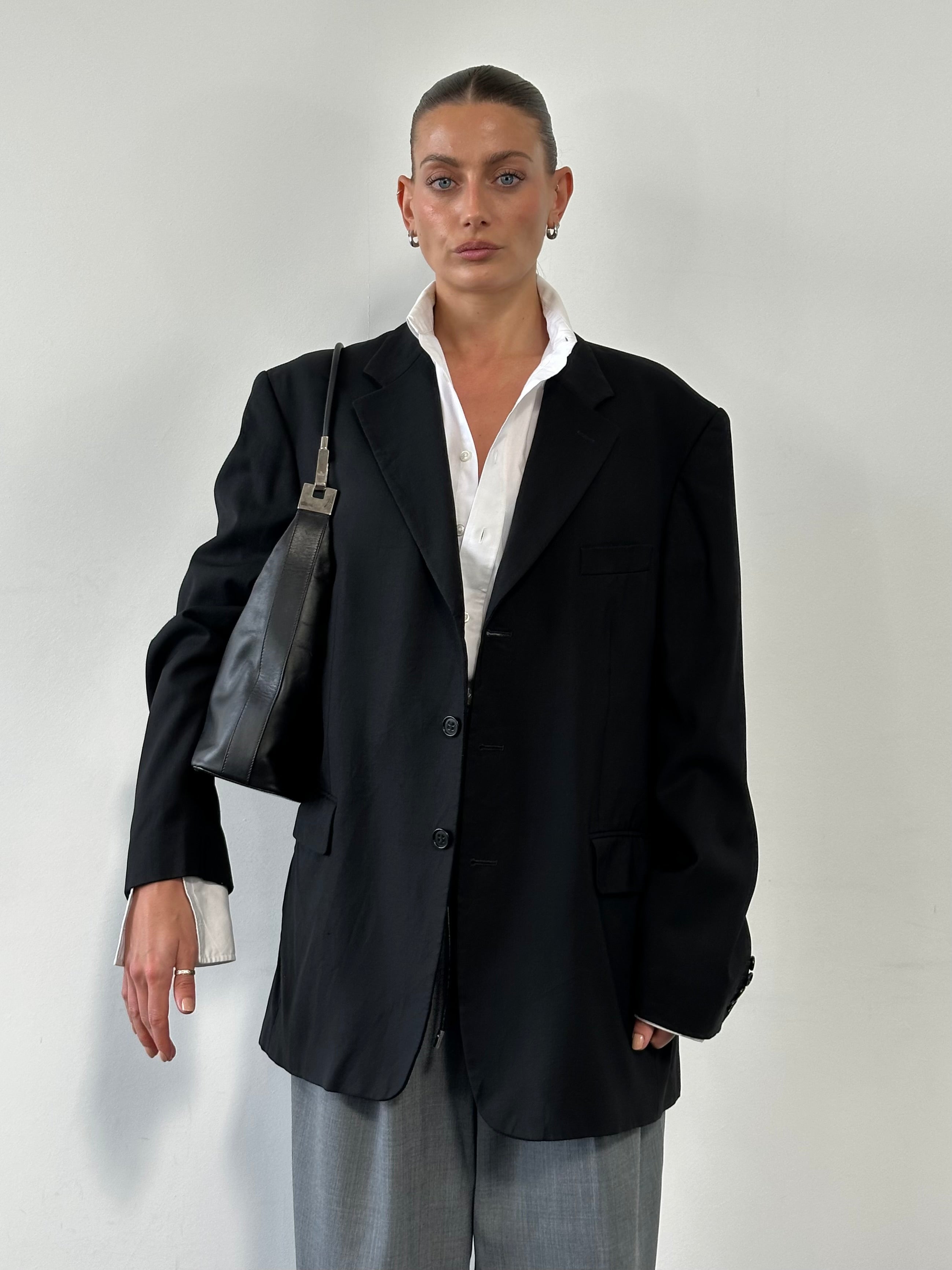 Yves Saint Laurent 1990s pure wool single-breasted blazer in size 46R/XXL, tailored fit with classic lapel and button closure.