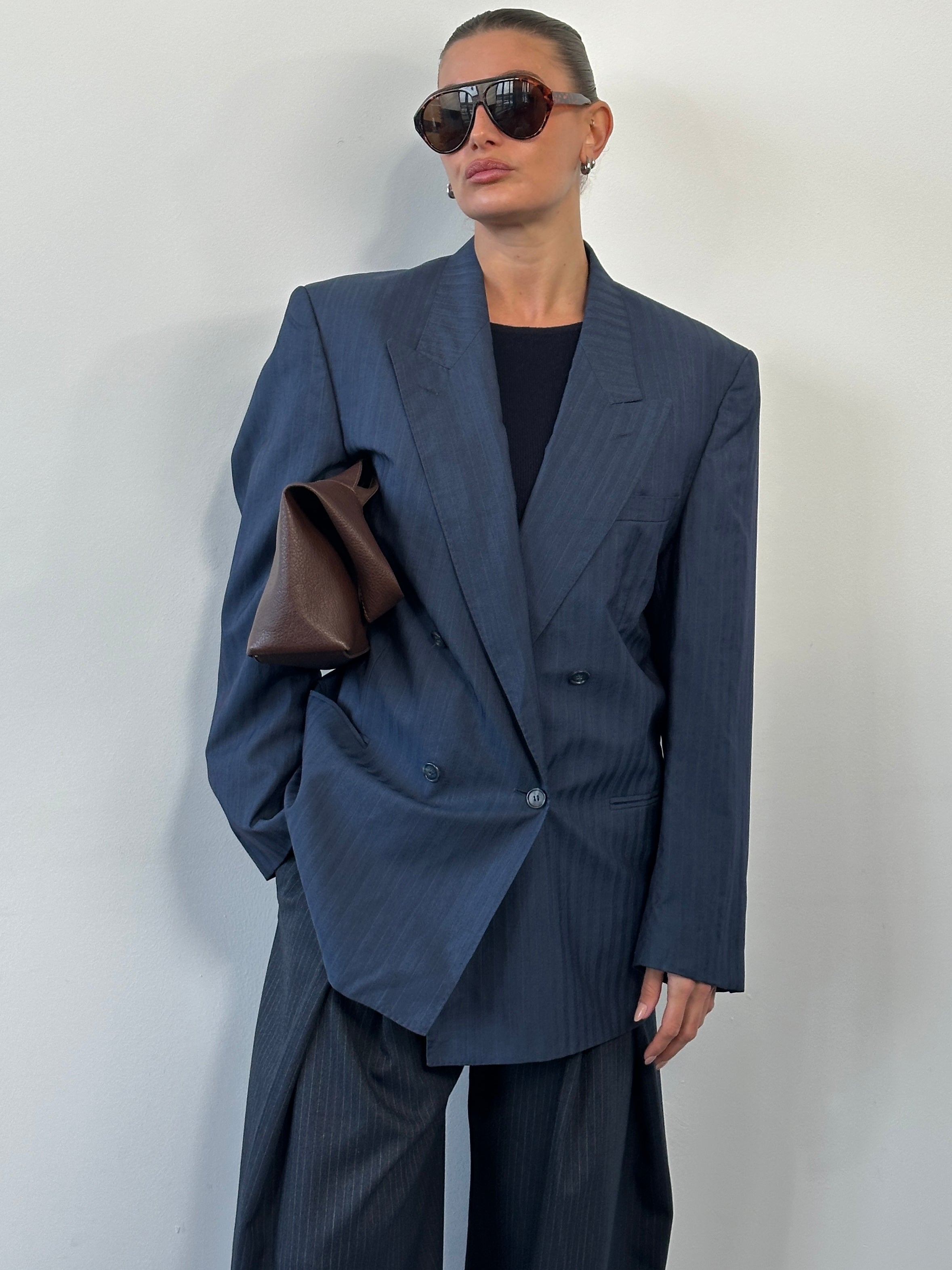 Yves Saint Laurent Pour Homme 1990s wool silk double-breasted blazer in size 42R/L, navy blue with notch lapel and front buttons.