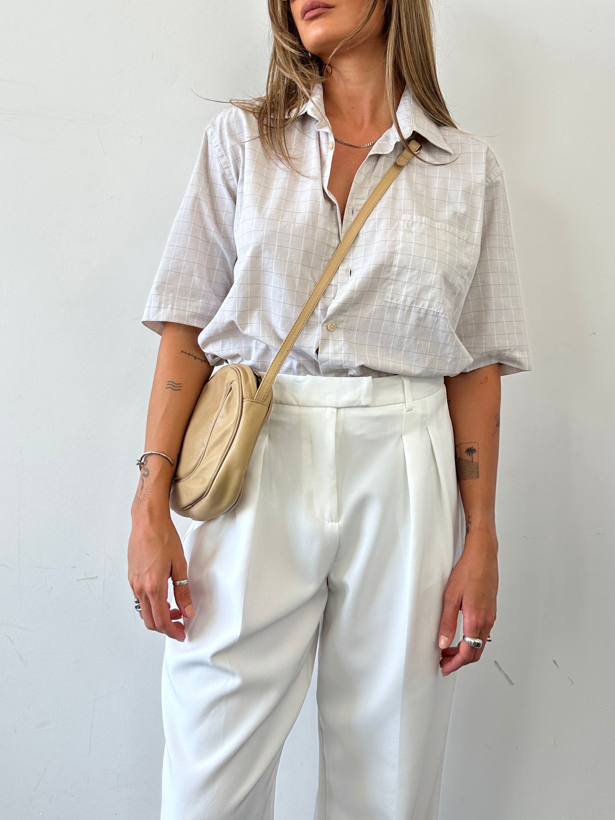 Vintage faux leather crossbody bag with adjustable strap and classic design, perfect for everyday use.