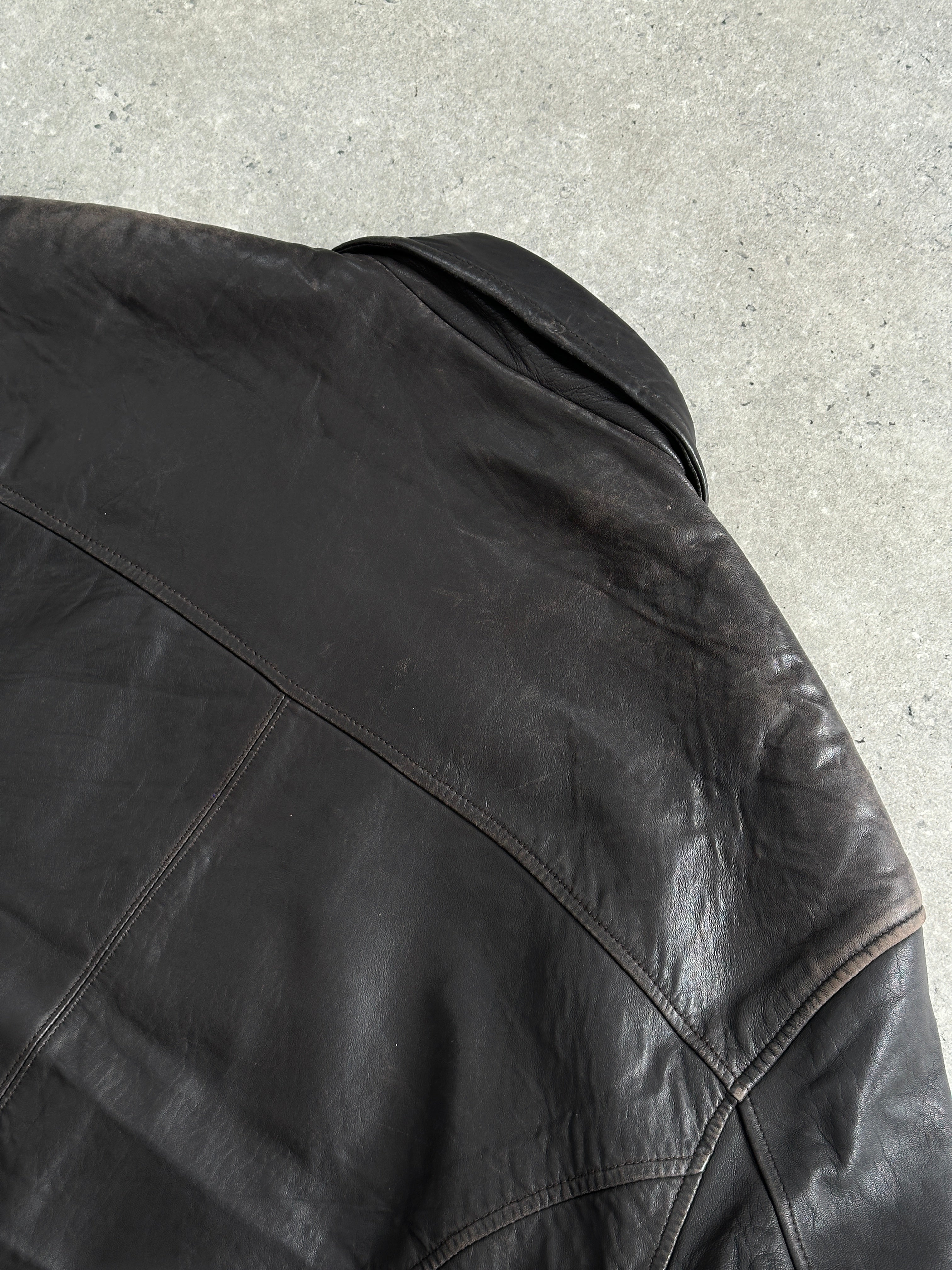 London Fog distressed leather jacket in size L, featuring a vintage 1990s style with rugged leather texture.