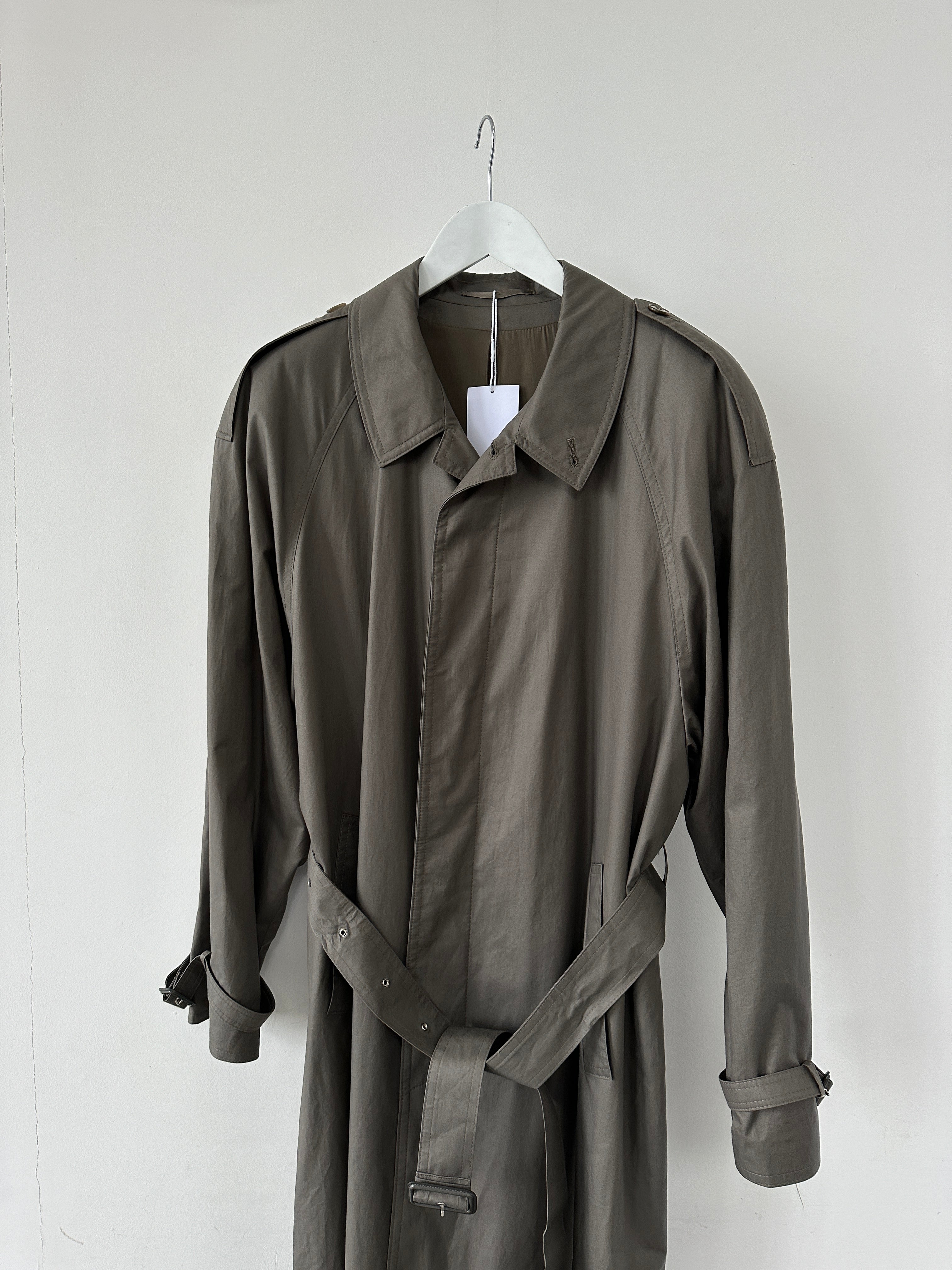 Vintage XL trench coat with concealed placket, belt, and classic design, showcasing a timeless vintage coat style.