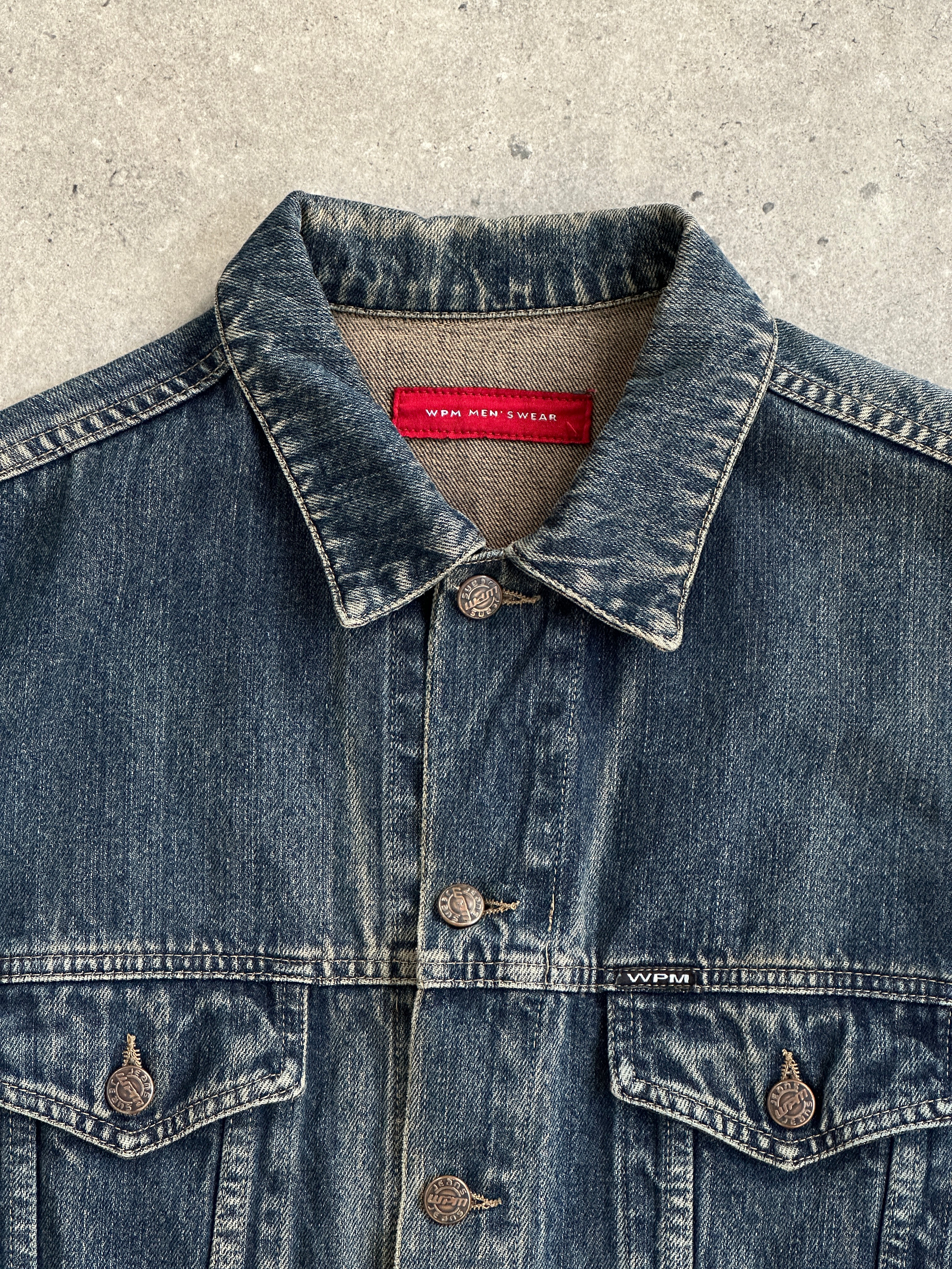 Italian Vintage washed denim jacket in size M/L, showcasing classic distressed denim with a vintage-inspired design.