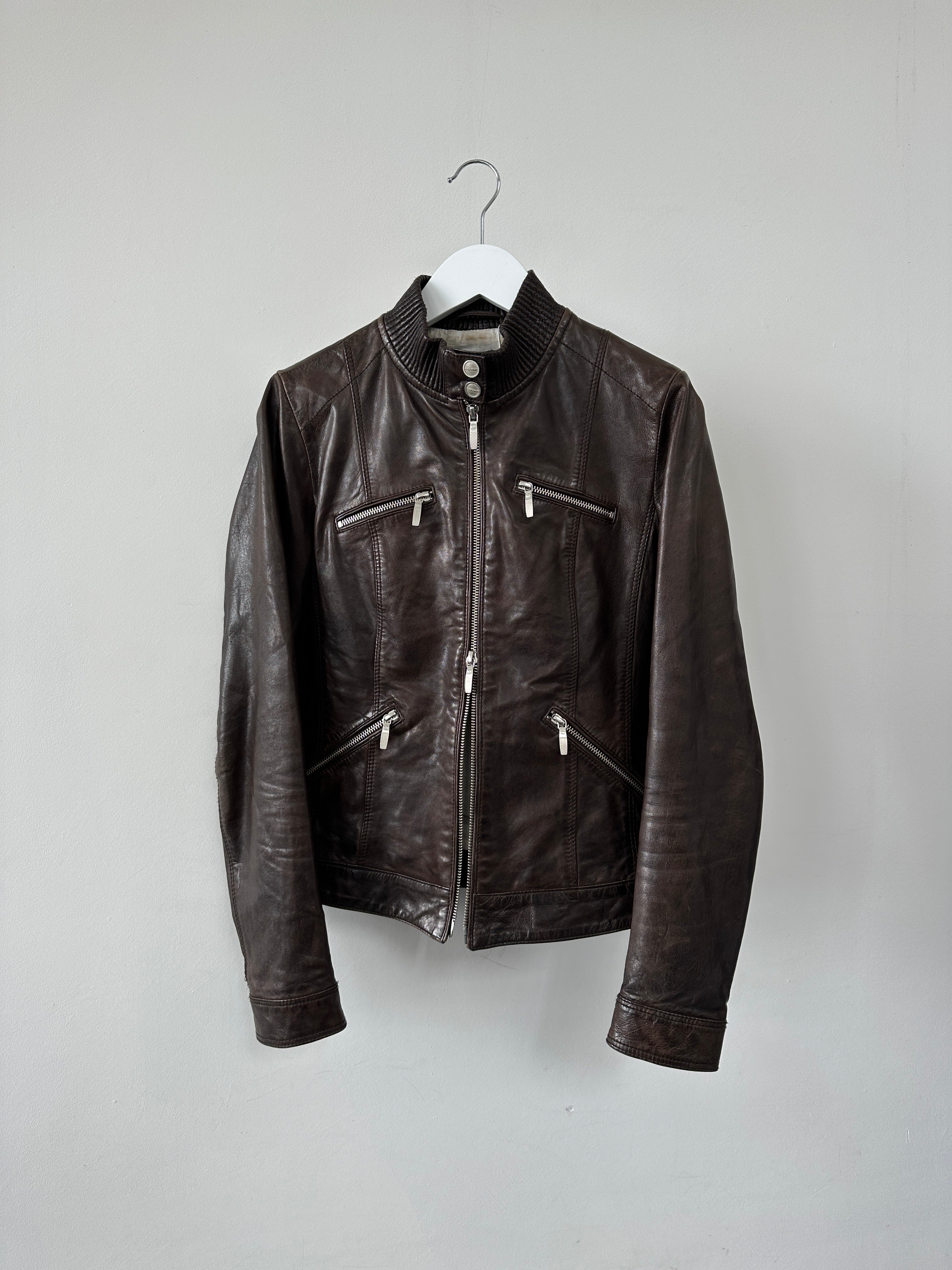 Vintage double zip fitted biker leather jacket in XS/S displayed on a hanger, showcasing classic design and quality leather material.