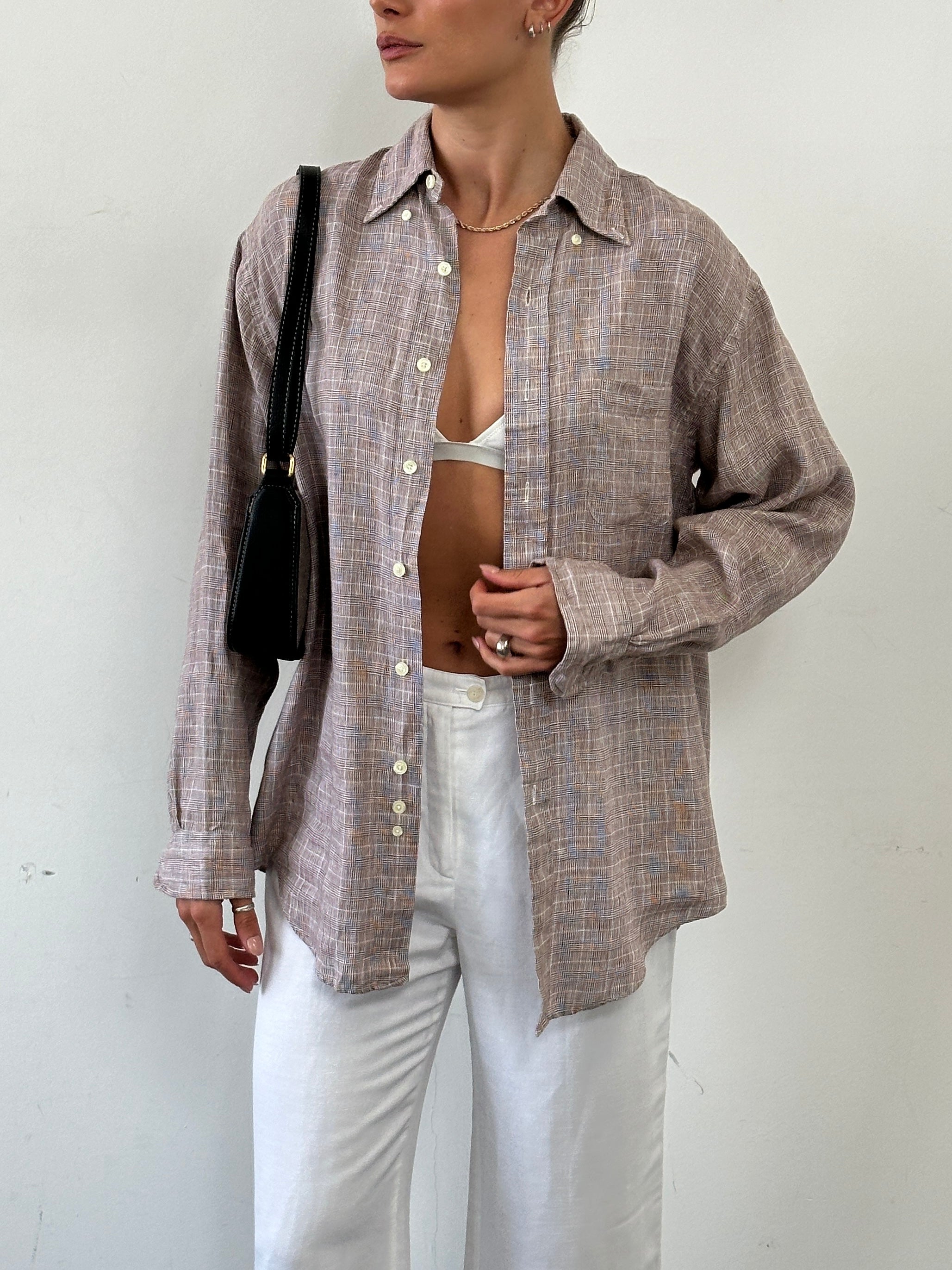 Brooks Brothers cotton check flannel shirt in size L/XL, featuring a classic plaid pattern and button-front design.